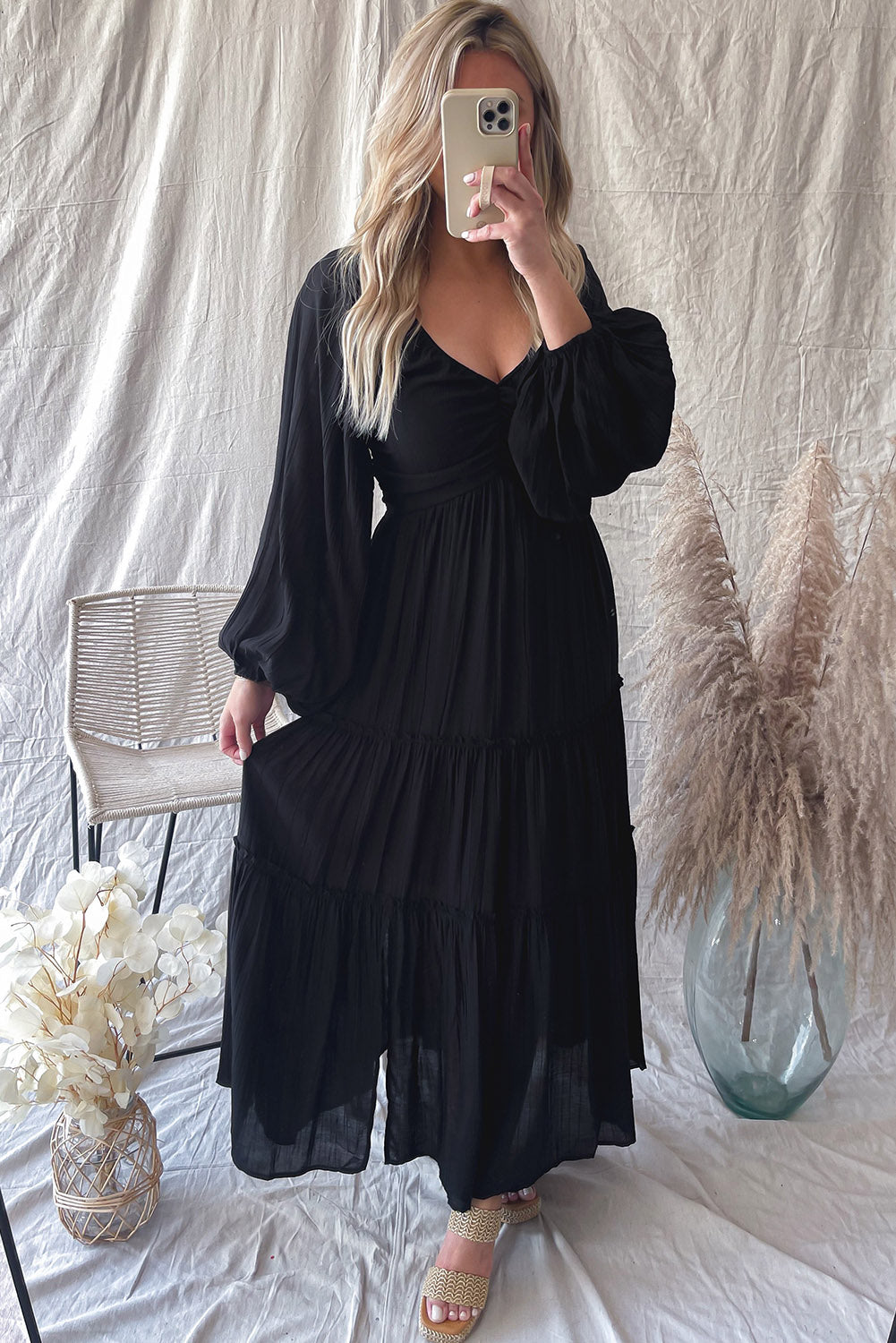 Elegant Black V Neck Bowknot Cutout Frill Tiered Maxi Dress showcasing a flattering neckline and ruffled details.