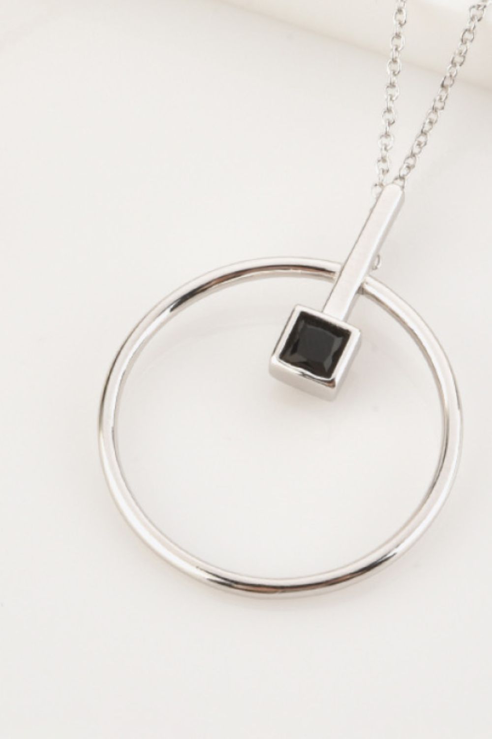 Elegant Black Zircon 925 Sterling Silver Necklace showcasing modern design with black zircon centerpiece and adjustable chain.