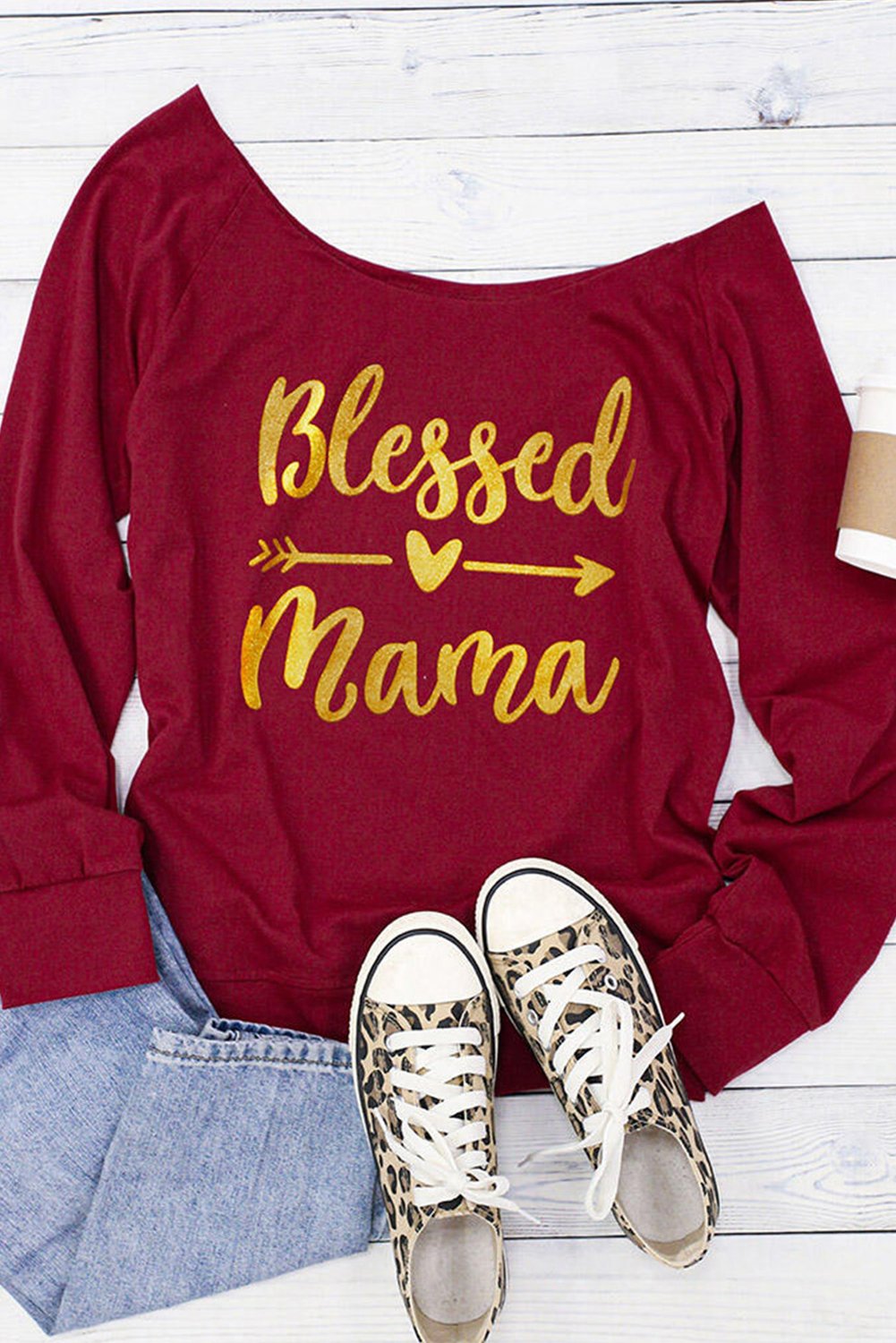 A vibrant Blessed Mama Heart Arrow Off Shoulder Blouse featuring a colorful print and stylish off-shoulder design, perfect for fashionable moms.