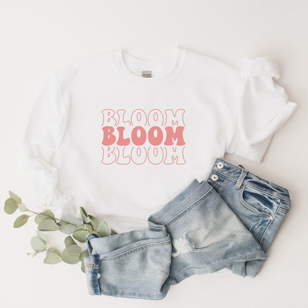 Colorful graphic sweatshirt featuring a stacked 'Bloom' design, perfect for casual wear.