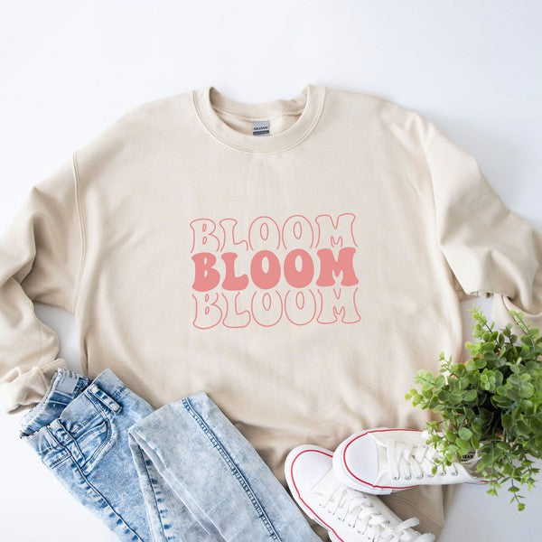 Colorful graphic sweatshirt featuring a stacked 'Bloom' design, perfect for casual wear.