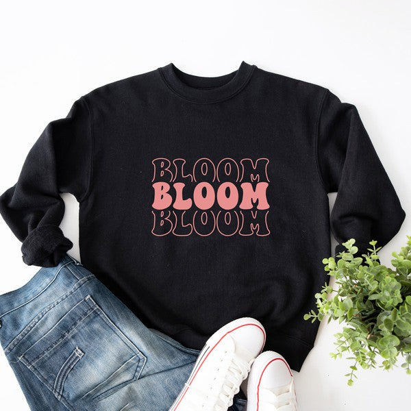 Colorful graphic sweatshirt featuring a stacked 'Bloom' design, perfect for casual wear.