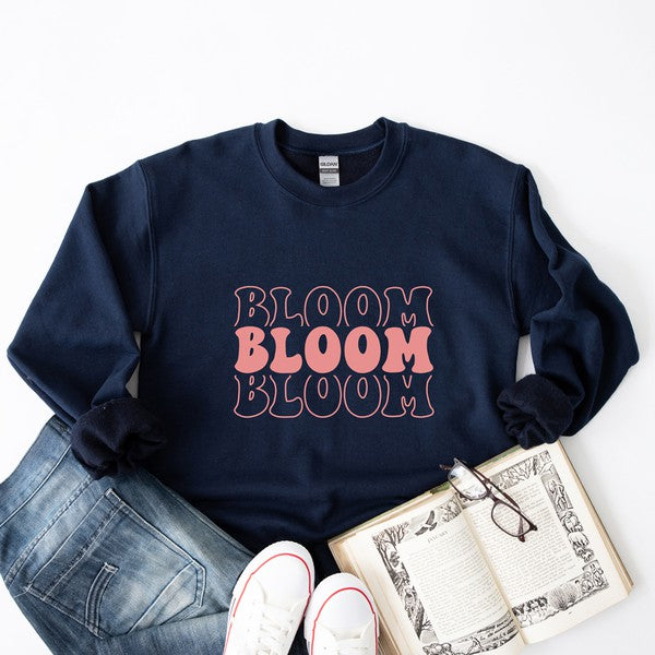 Colorful graphic sweatshirt featuring a stacked 'Bloom' design, perfect for casual wear.