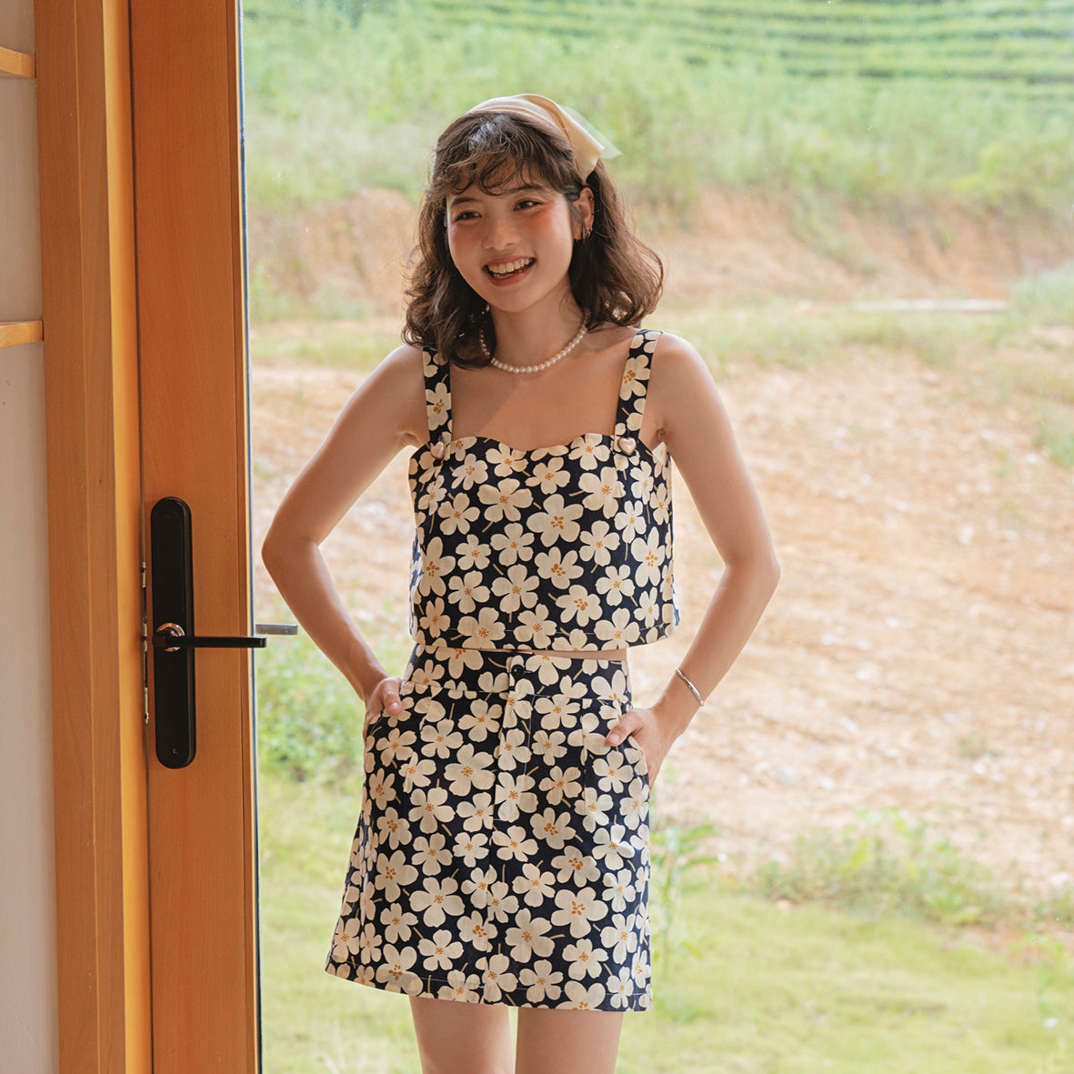 Blooming Top set featuring floral motifs, cotton fabric, and decorative heart buttons, displayed elegantly on a mannequin.