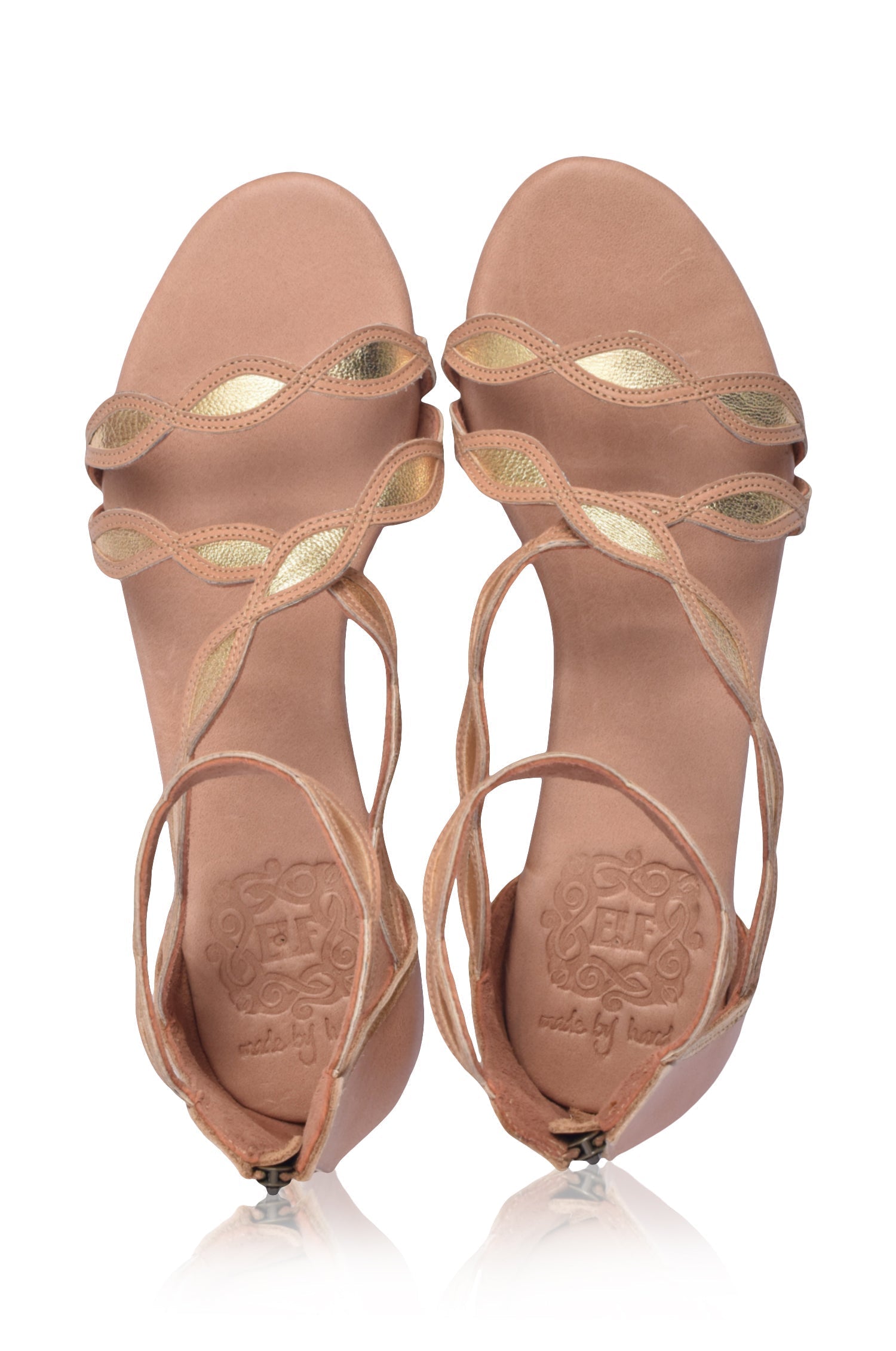 A pair of Blossom Leather Sandals featuring a floral design, crafted from high-quality leather with an adjustable ankle buckle and back zipper.