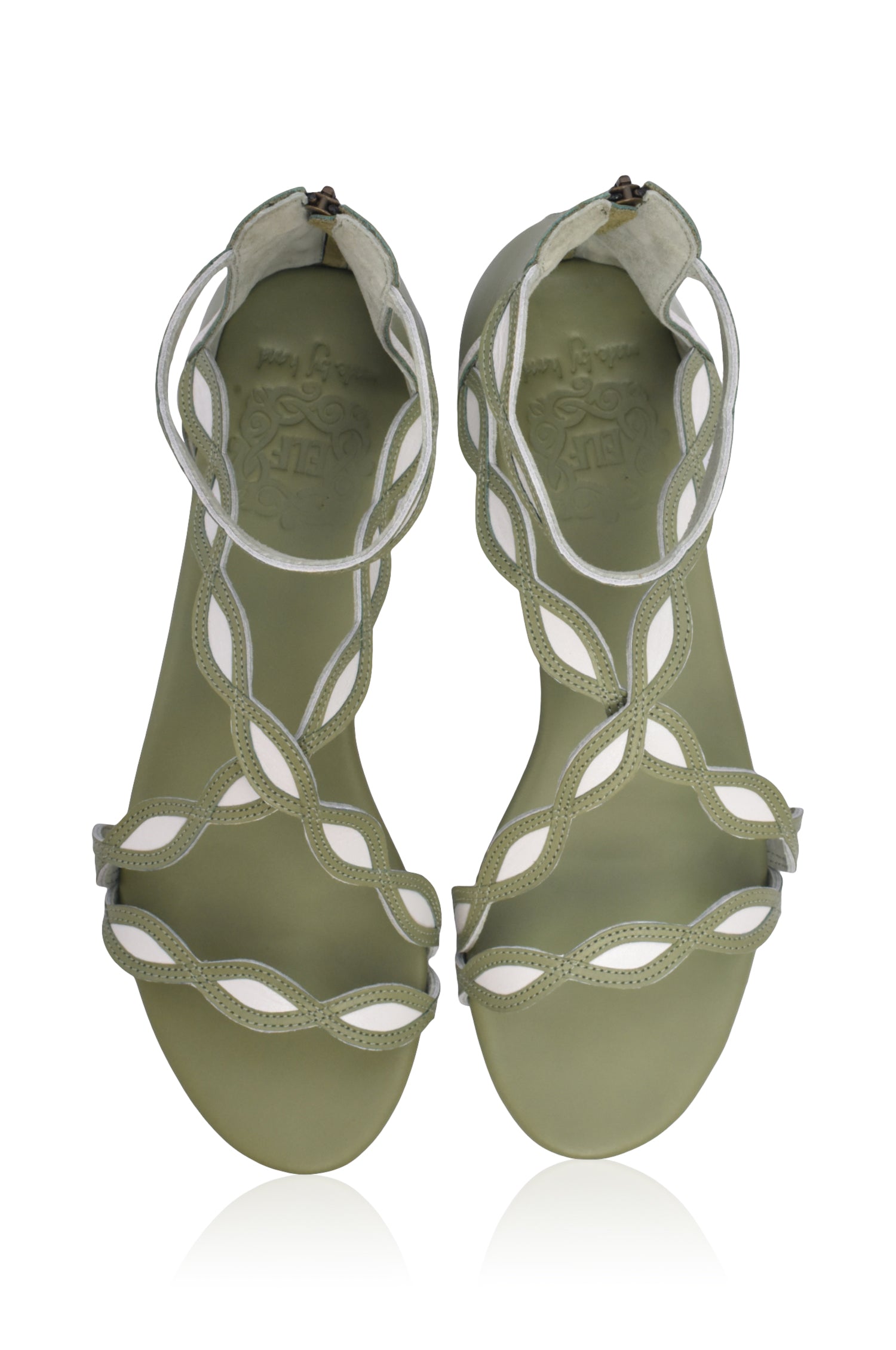 A pair of Blossom Leather Sandals featuring a floral design, crafted from high-quality leather with an adjustable ankle buckle and back zipper.