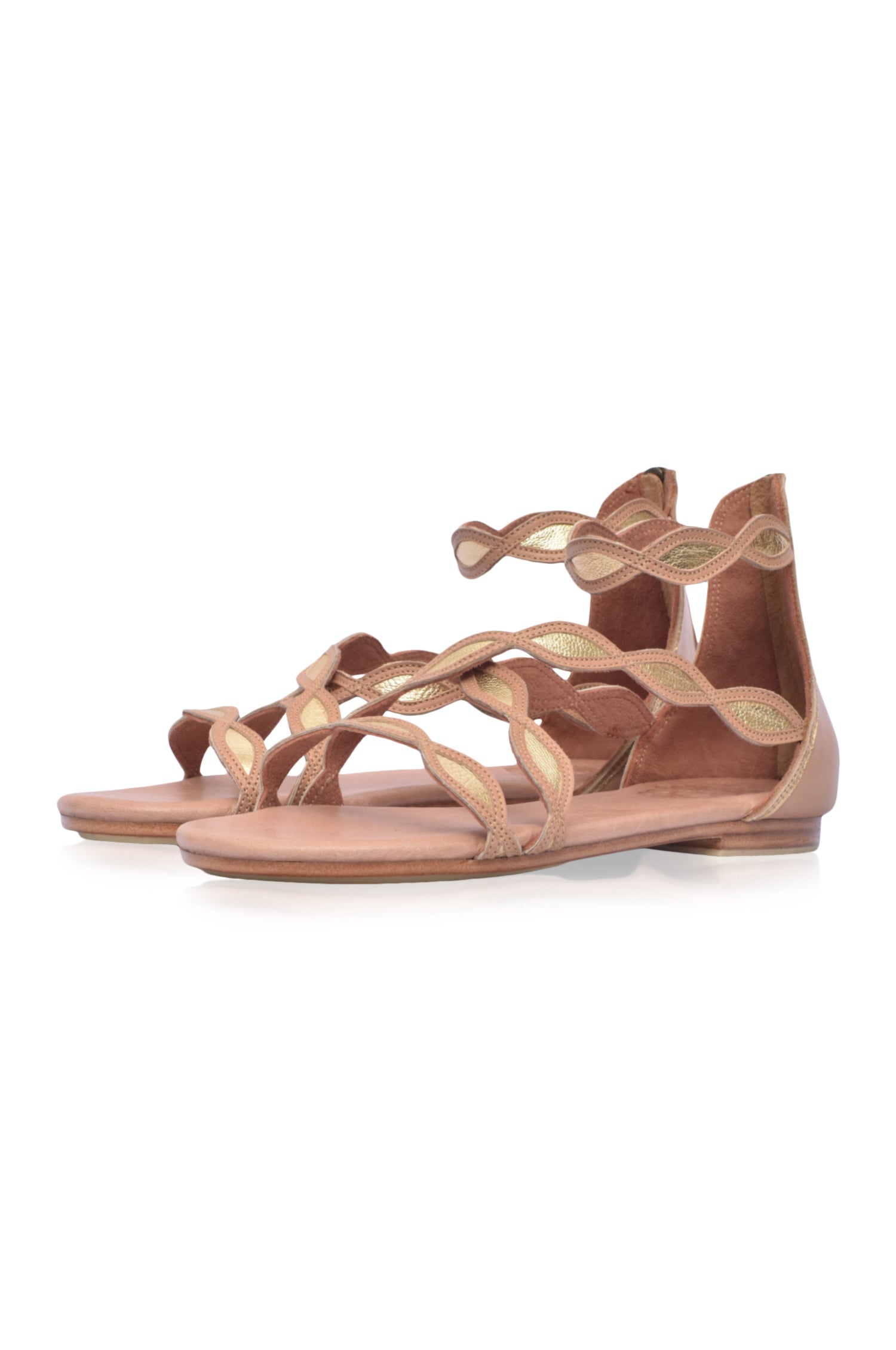 A pair of Blossom Leather Sandals featuring a floral design, handcrafted from high-quality leather with an adjustable ankle buckle and back zipper.