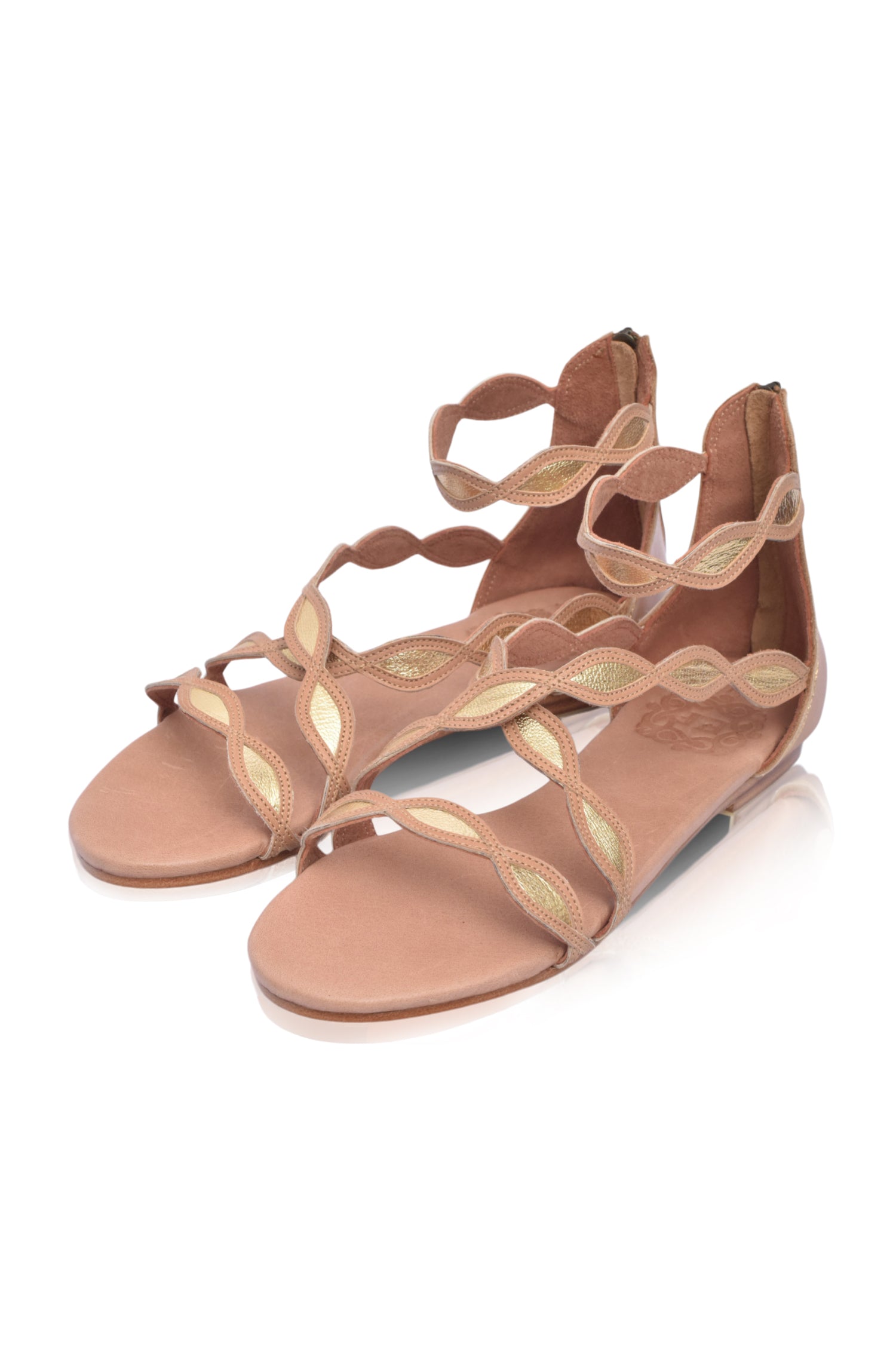 A pair of Blossom Leather Sandals featuring a floral design, handcrafted from high-quality leather with an adjustable ankle buckle and back zipper.