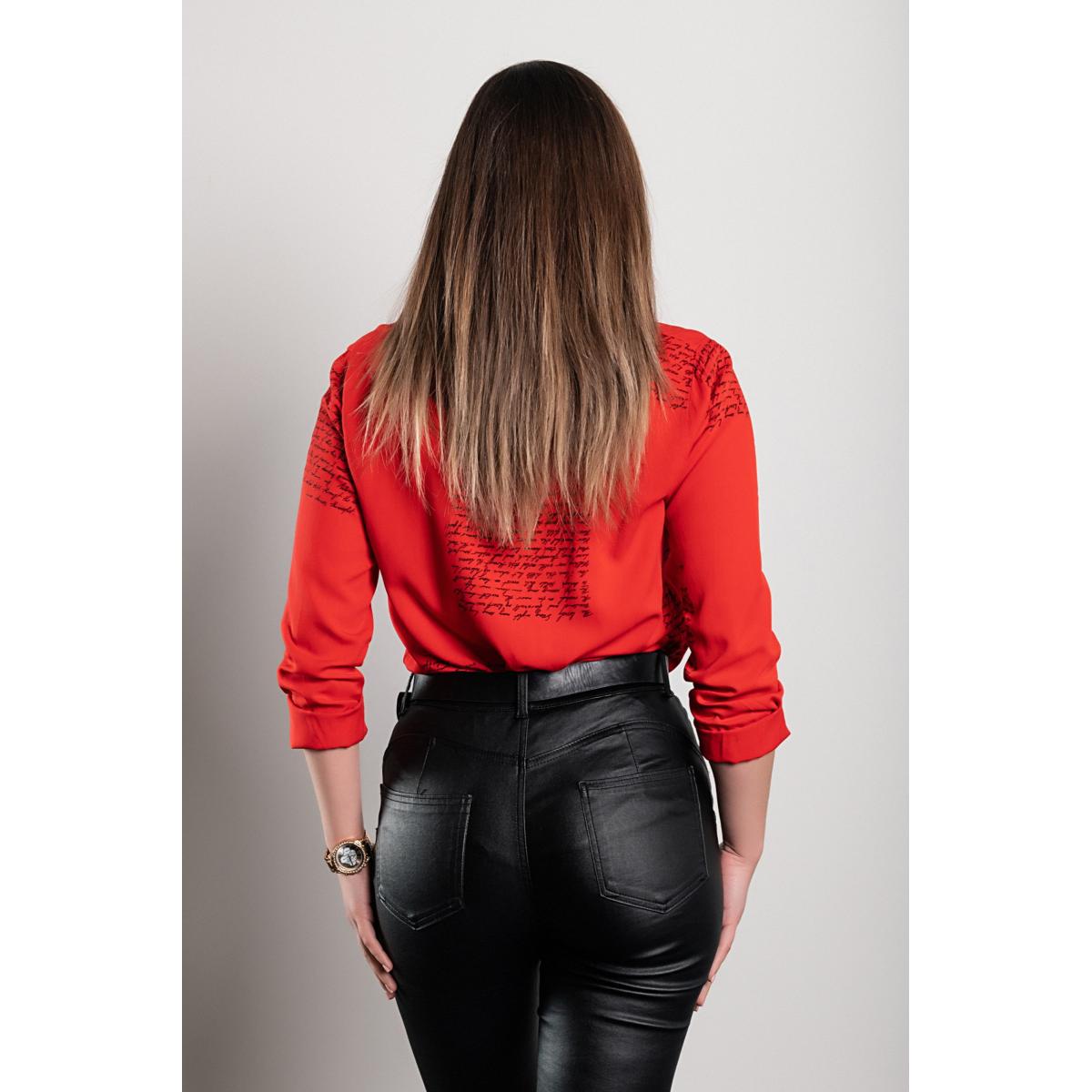 A stylish red blouse with a sporty yet elegant design, perfect for various fashion combinations.