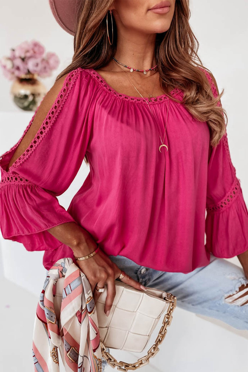 Elegant pink blouse with crochet edge and long sleeves featuring stylish cutouts, perfect for casual and formal occasions.