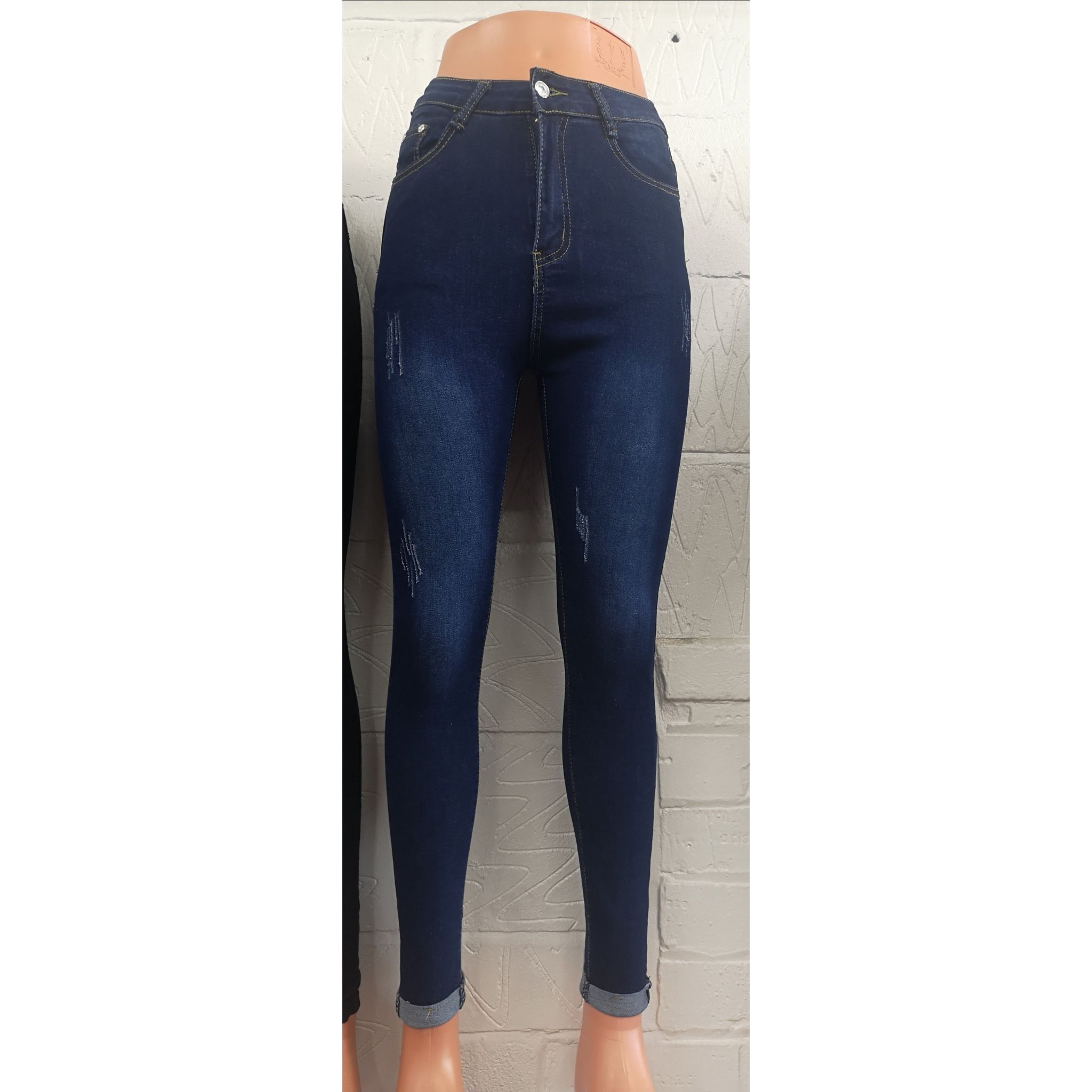 A pair of blue distressed skinny jeans featuring a stylish design with slight distressing, perfect for casual wear.