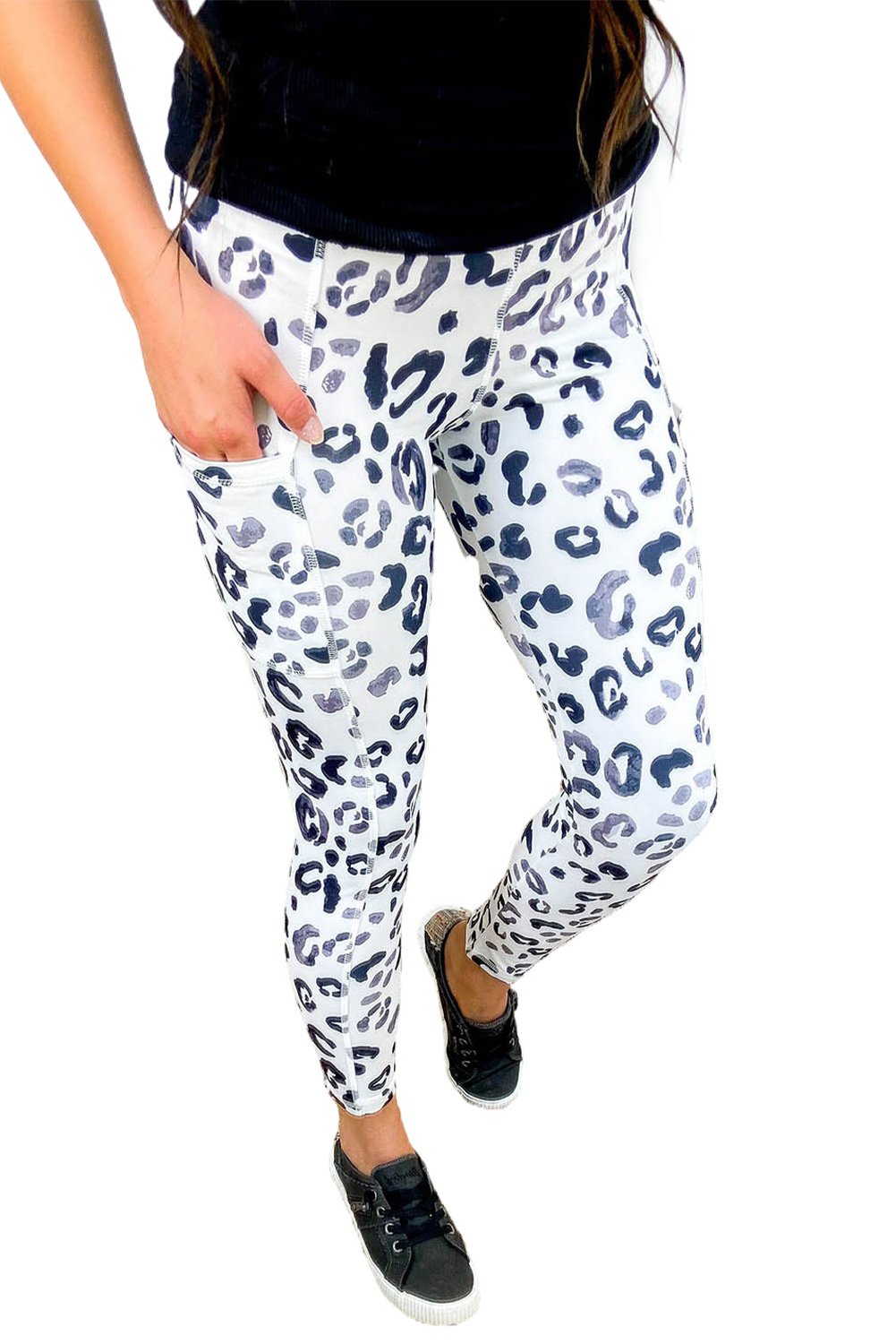 Blue leopard print athletic leggings with side pockets, perfect for workouts and casual wear.