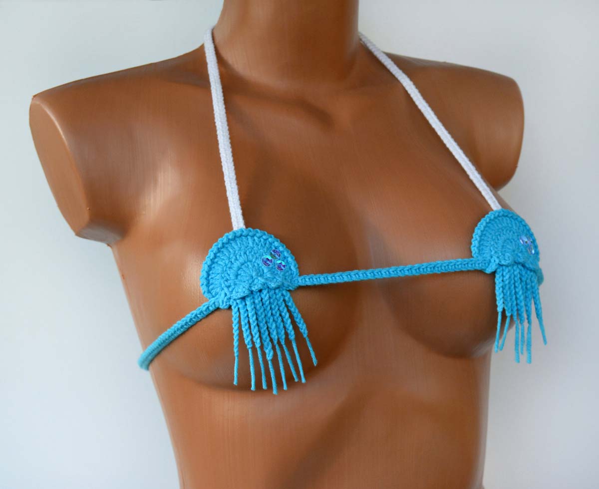 Handmade blue micro G string bikini bottom showcasing minimal coverage and stylish design, perfect for beach and pool activities.