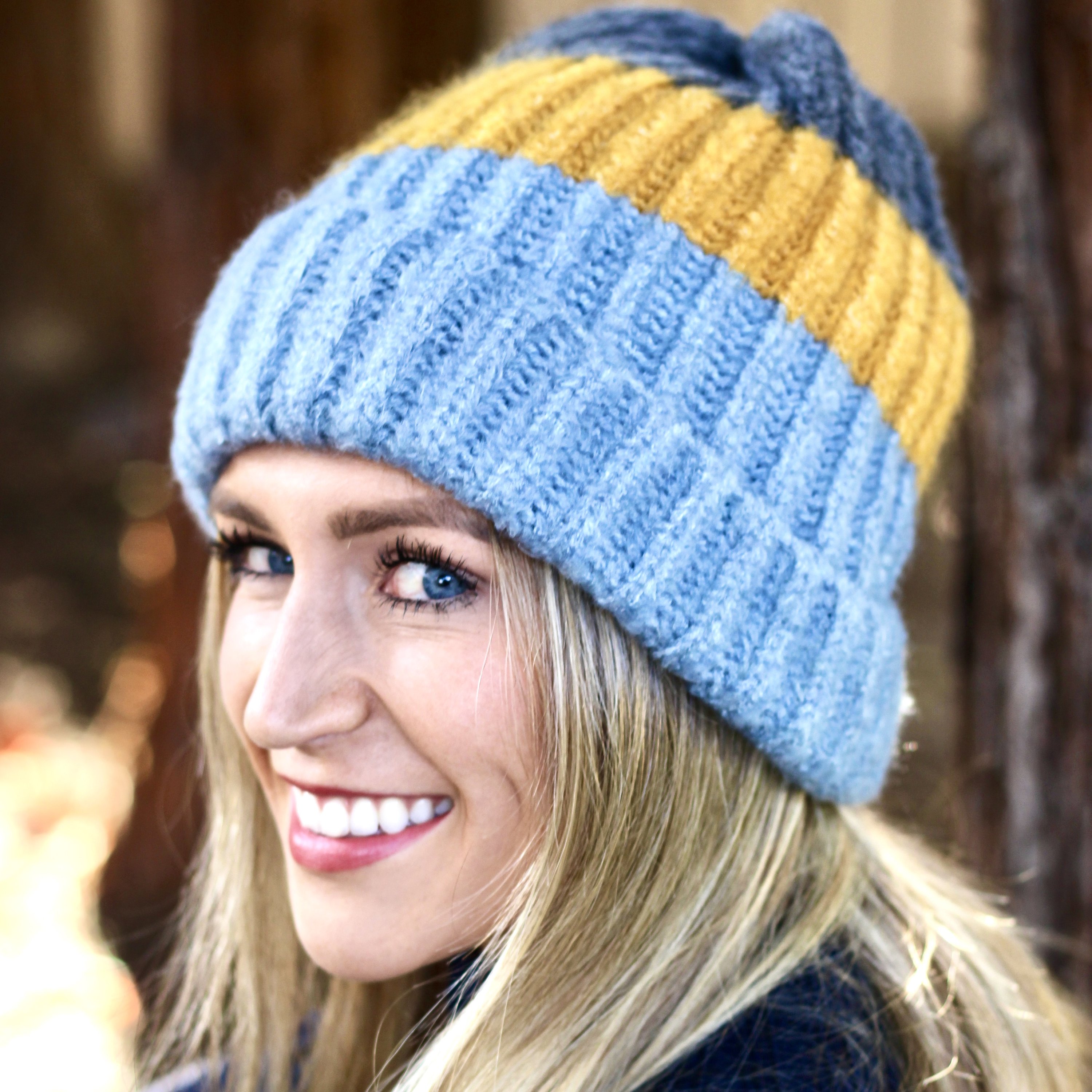 Blue and mustard colorblock beanie with a slouchy design, perfect for winter wear.