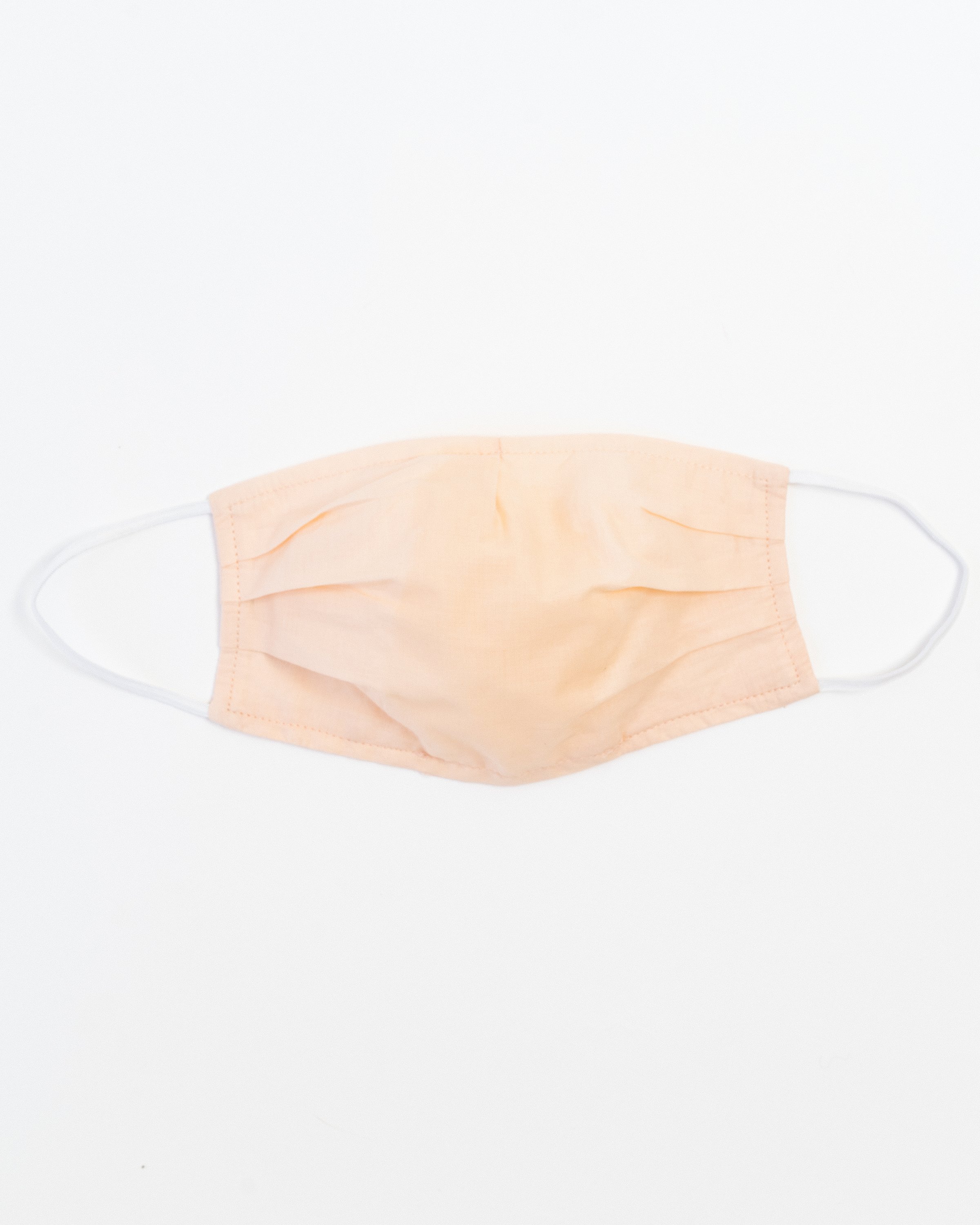 Blush Ultra-Light Face Mask made of breathable cotton with pleats for comfort and a filter pocket.