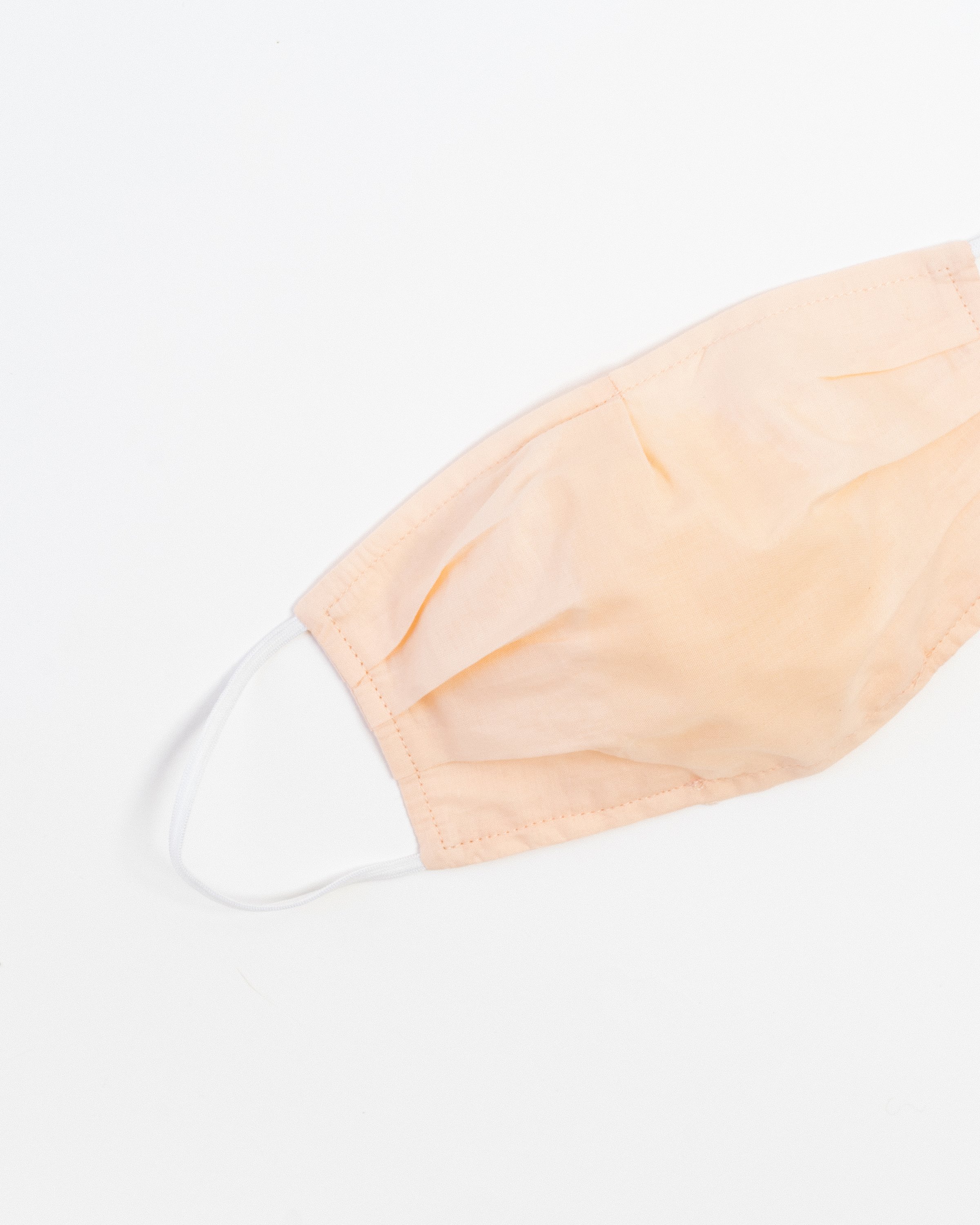 Blush Ultra-Light Face Mask made of breathable cotton with pleats for comfort and a filter pocket.