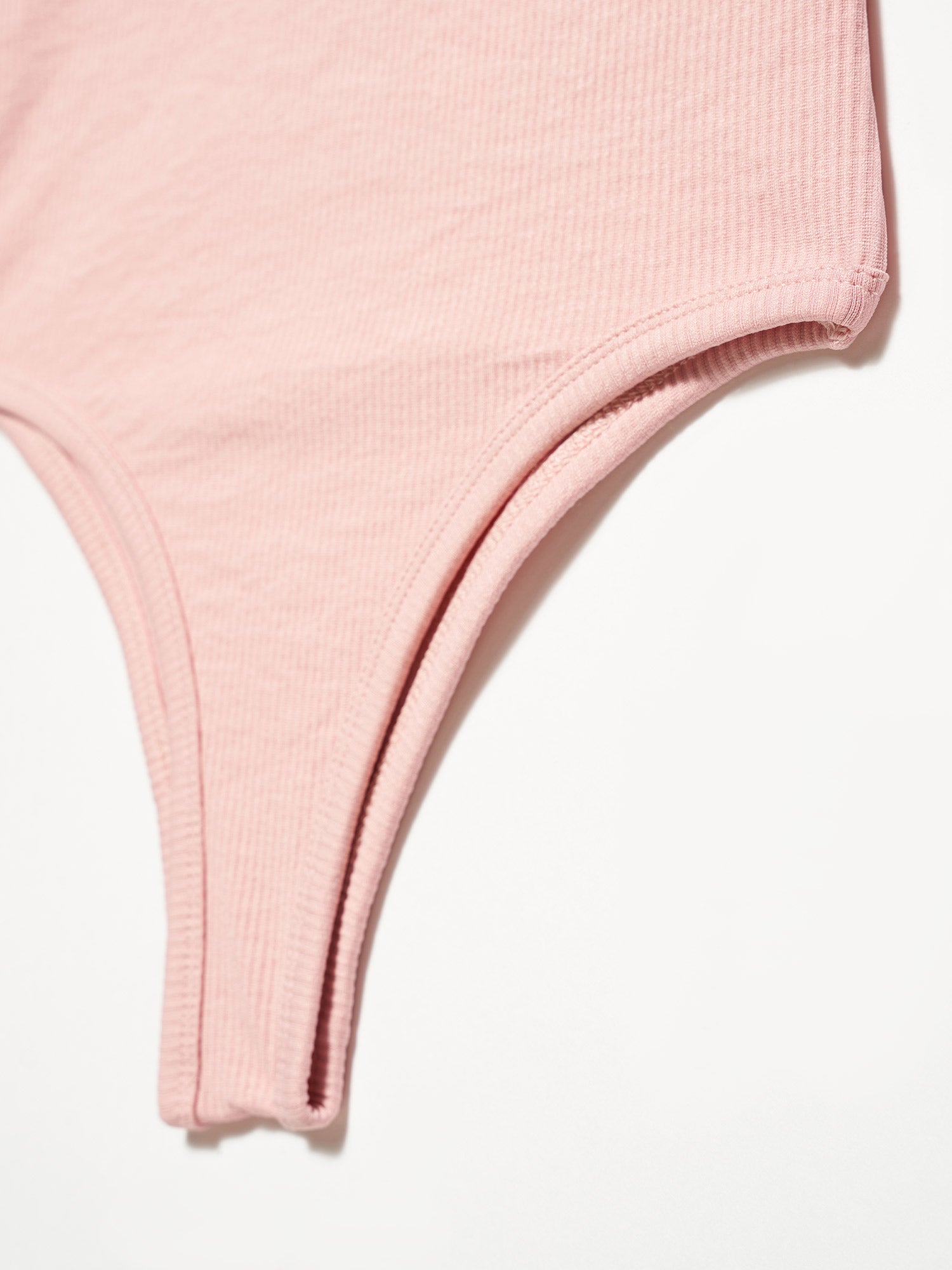 A stylish bodysuit made from a blend of polyester and elastane, showcasing its sleek design and comfortable fit.