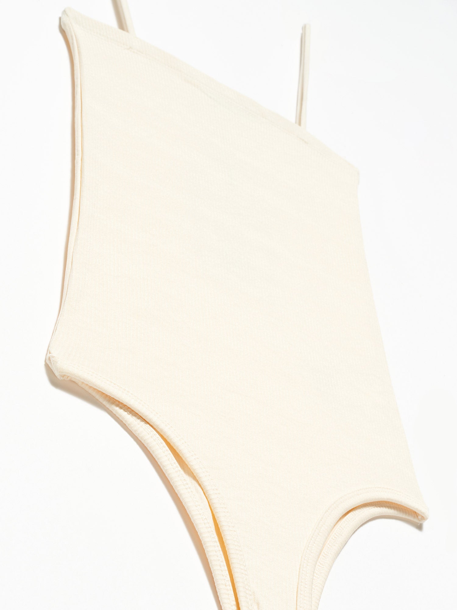 A stylish bodysuit made from a blend of polyester and elastane, showcasing its sleek design and comfortable fit.