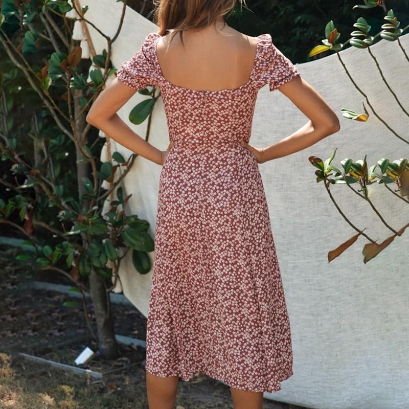 A stylish Bohemian floral print summer dress for women featuring short lantern sleeves and a split design, available in black, wine red, and yellow.