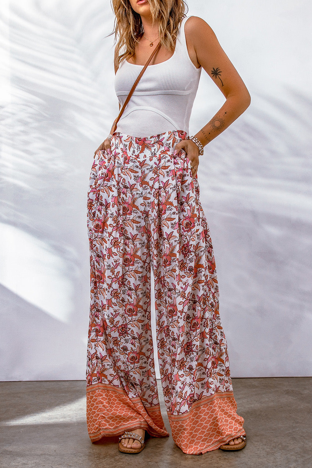 Bohemian Pleated Culottes featuring a floral pattern, made from 100% viscose, showcasing a long length and straight hem.