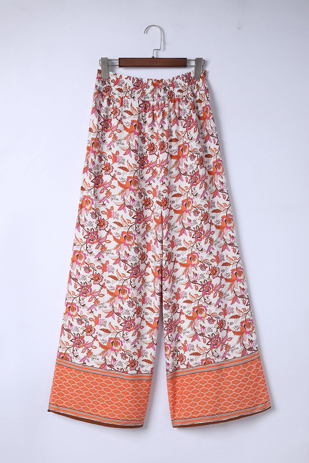 Bohemian Pleated Culottes featuring a floral pattern, made from 100% viscose, showcasing a long length and straight hem.