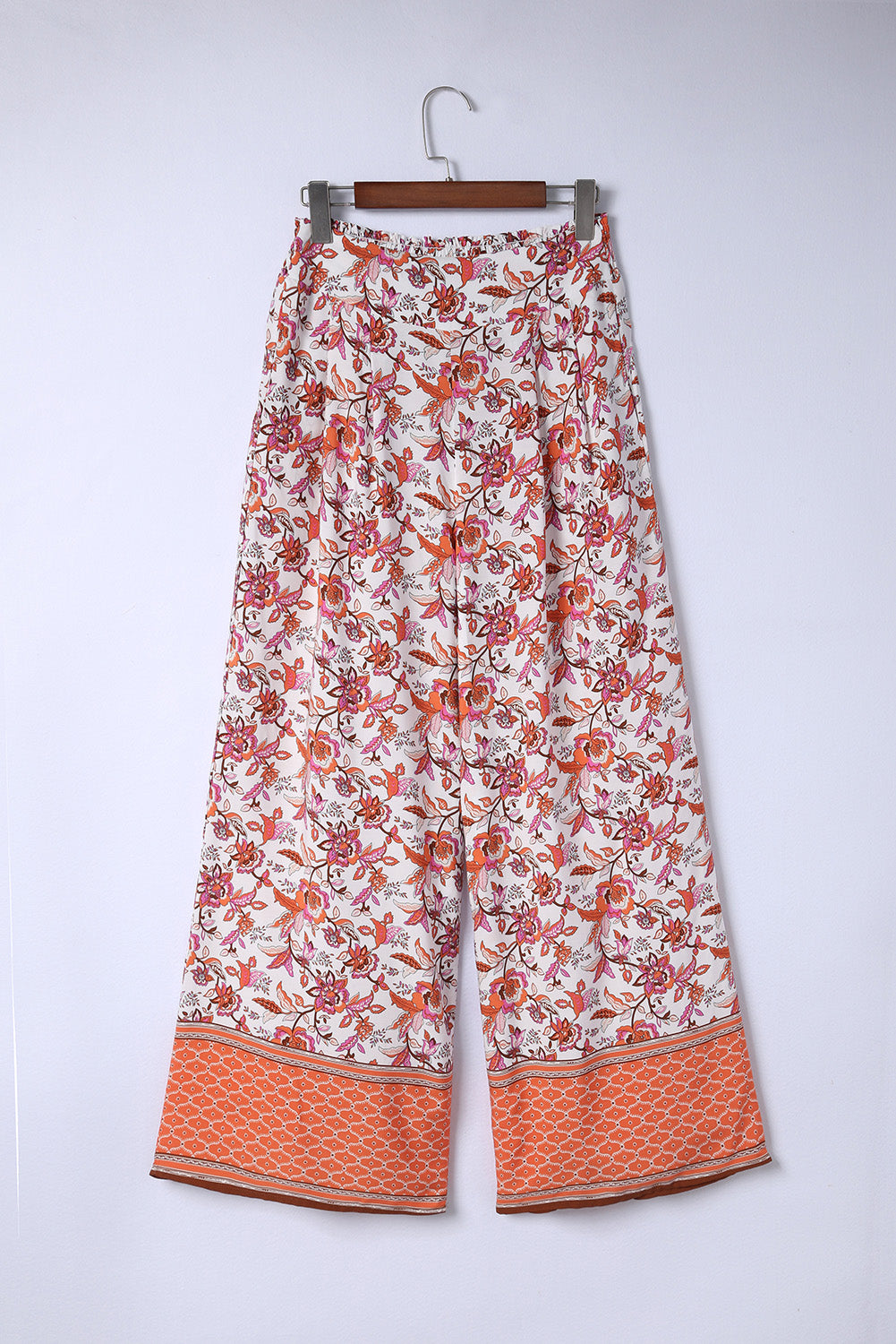 Bohemian Pleated Culottes featuring a floral pattern, made from 100% viscose, showcasing a long length and straight hem.