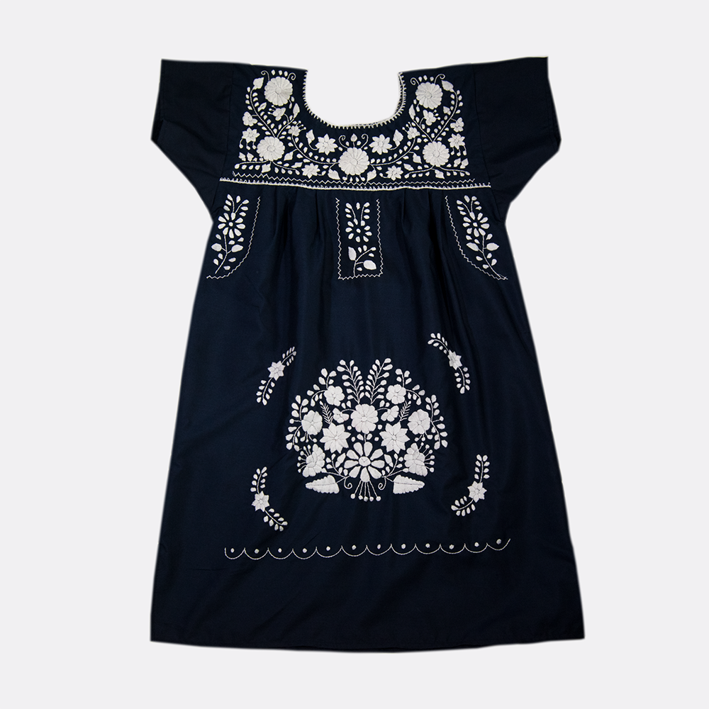 A beautiful navy blue dress adorned with white flowers, showcasing intricate hand embroidery, perfect for bohemian style.