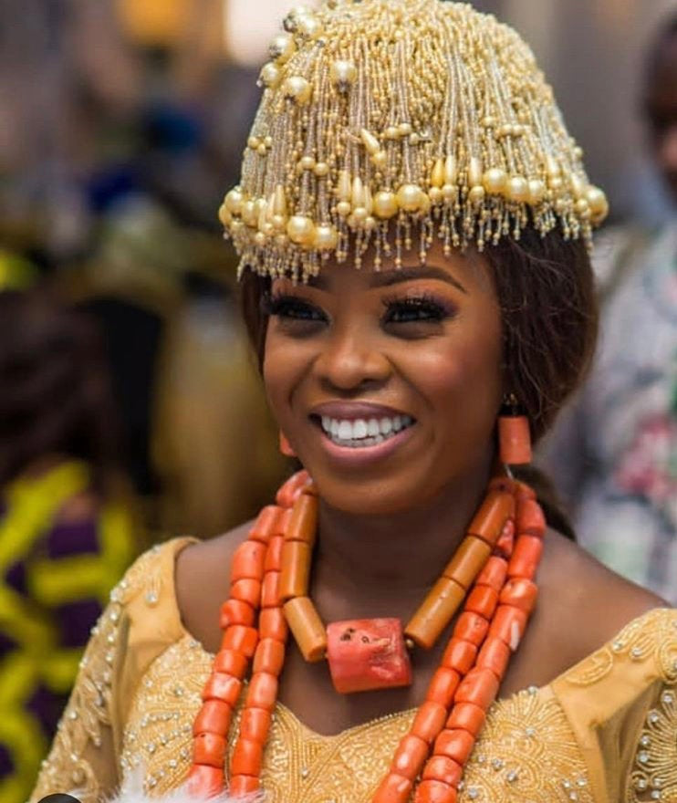 A beautifully handcrafted Boma Hat, an African bride crown made of colorful beads, showcasing intricate designs and vibrant colors.