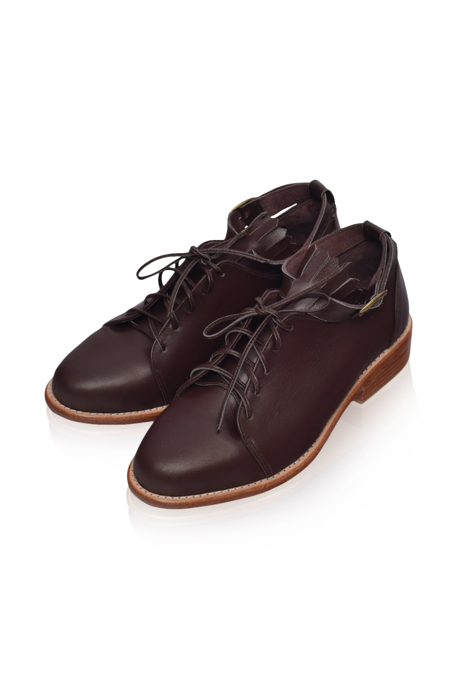 A pair of stylish Boston Leather Oxfords featuring fringe detailing and ankle strap, showcasing their elegant design and high-quality leather.