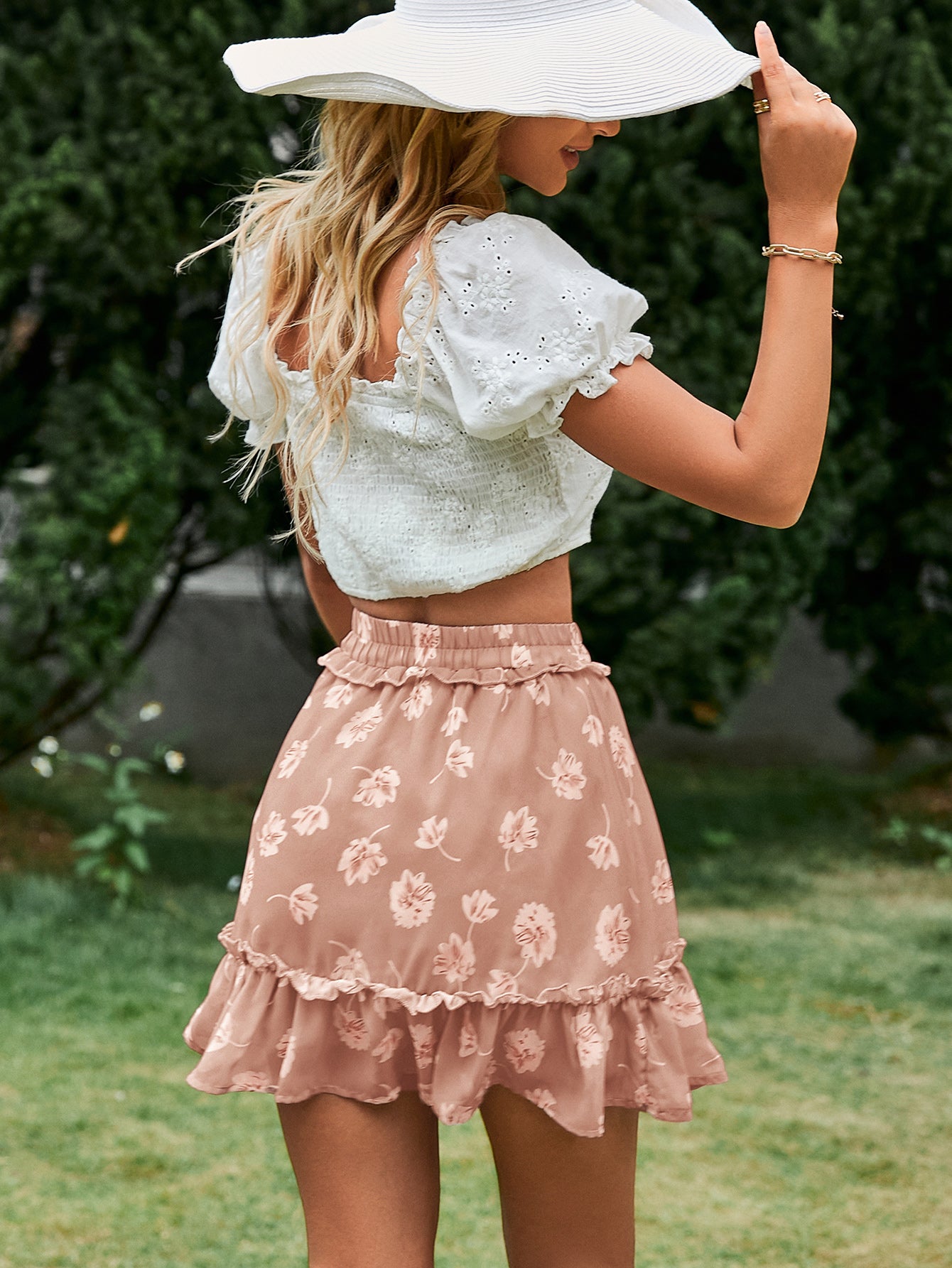 A stylish botanical print frill trim tiered skirt with an elastic waist, showcasing a vibrant floral pattern.