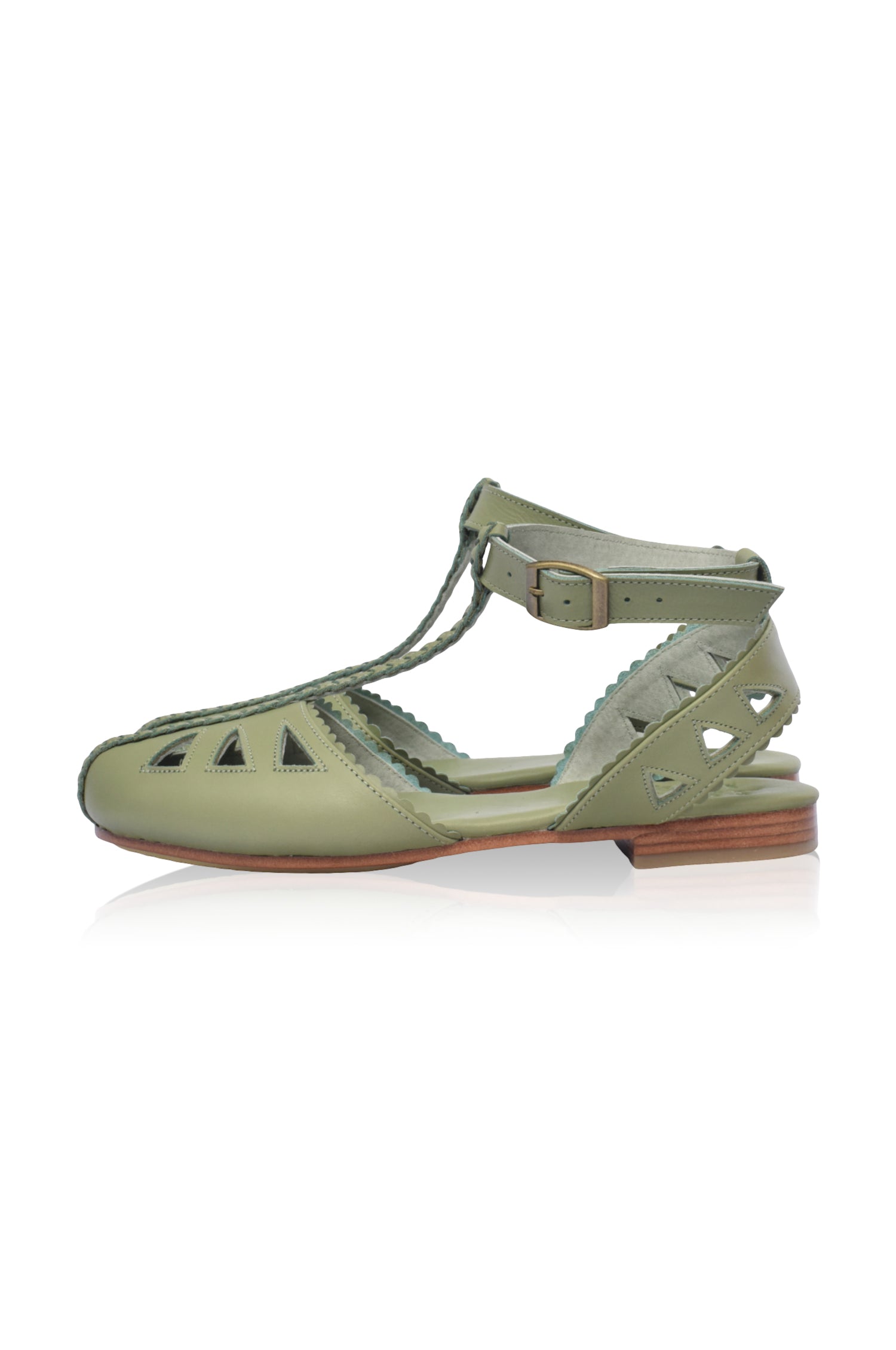 Bounty T-strap Leather Sandals showcasing a stylish design with round toe and scalloped edges, made from genuine leather.