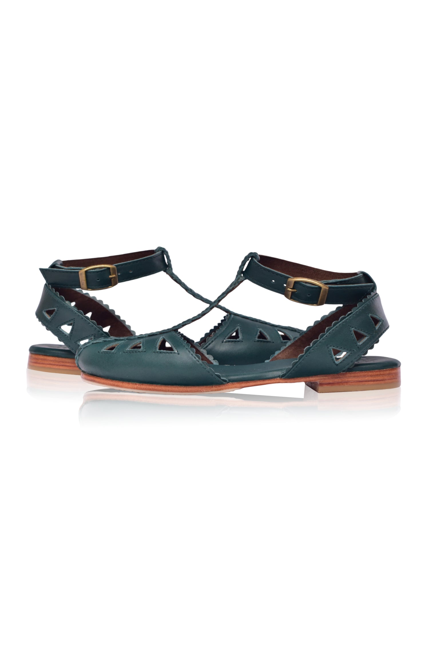 Bounty T-strap Leather Sandals showcasing a stylish design with round toe and scalloped edges, made from genuine leather.