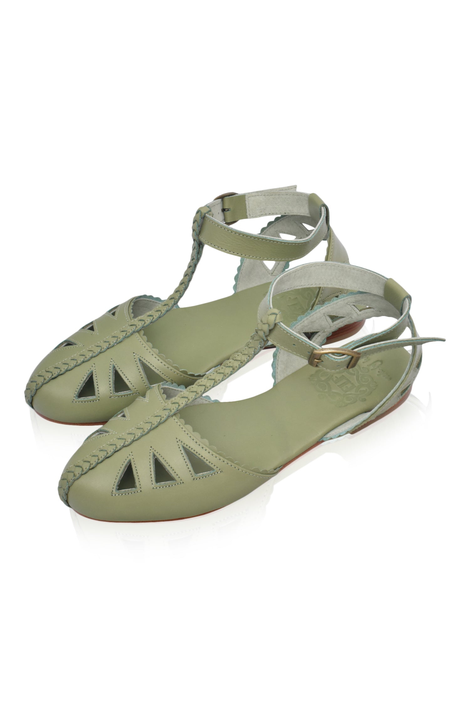 Bounty T-strap Leather Sandals featuring a stylish t-strap design, round toe, and scalloped edges, made from genuine leather.