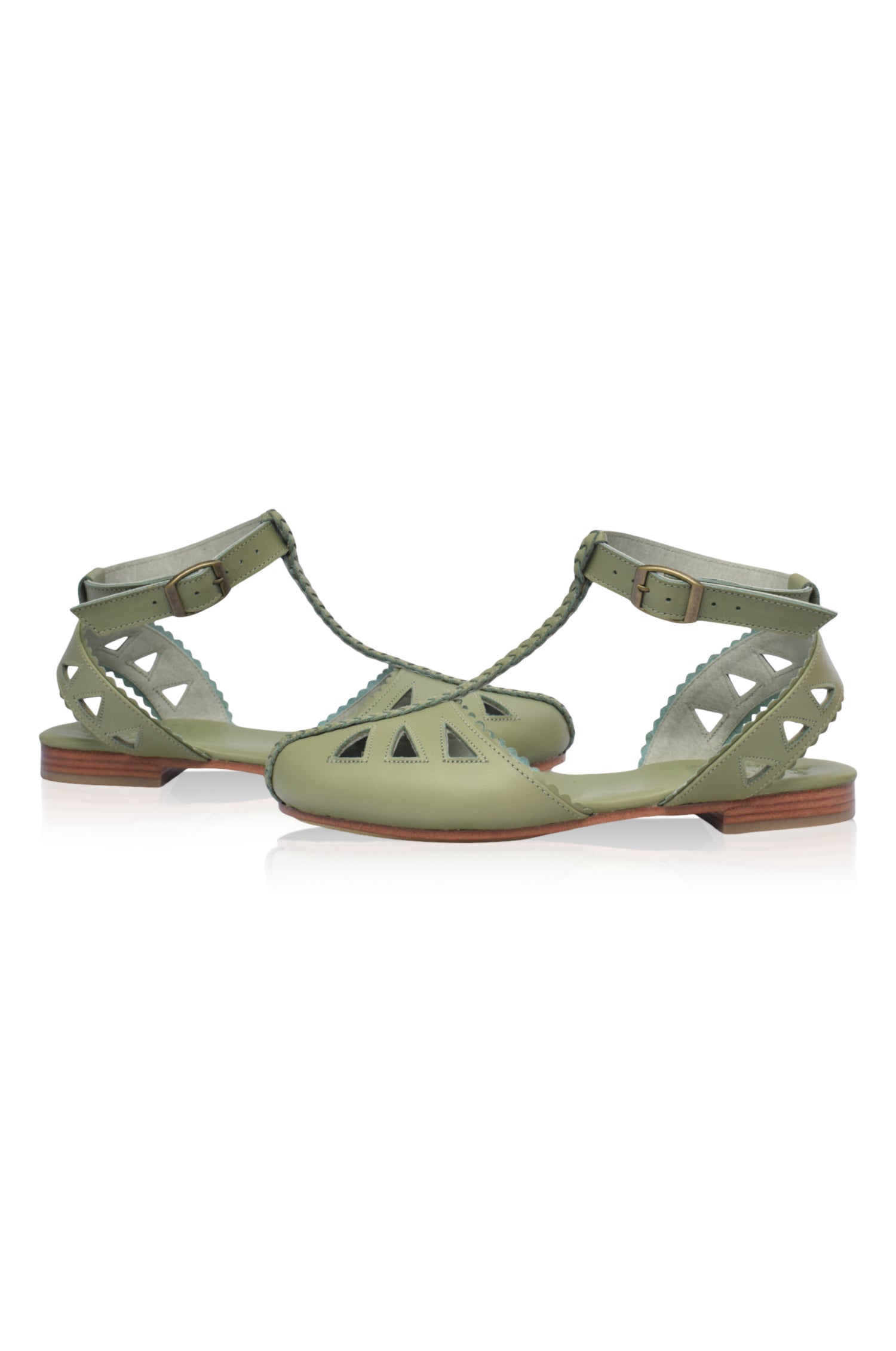 Bounty T-strap Leather Sandals featuring a stylish t-strap design, round toe, and scalloped edges, made from genuine leather.