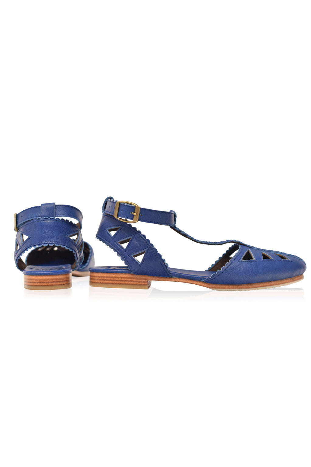 Bounty T-strap Leather Sandals showcasing round toe, cutouts, and scalloped edges in a stylish design.