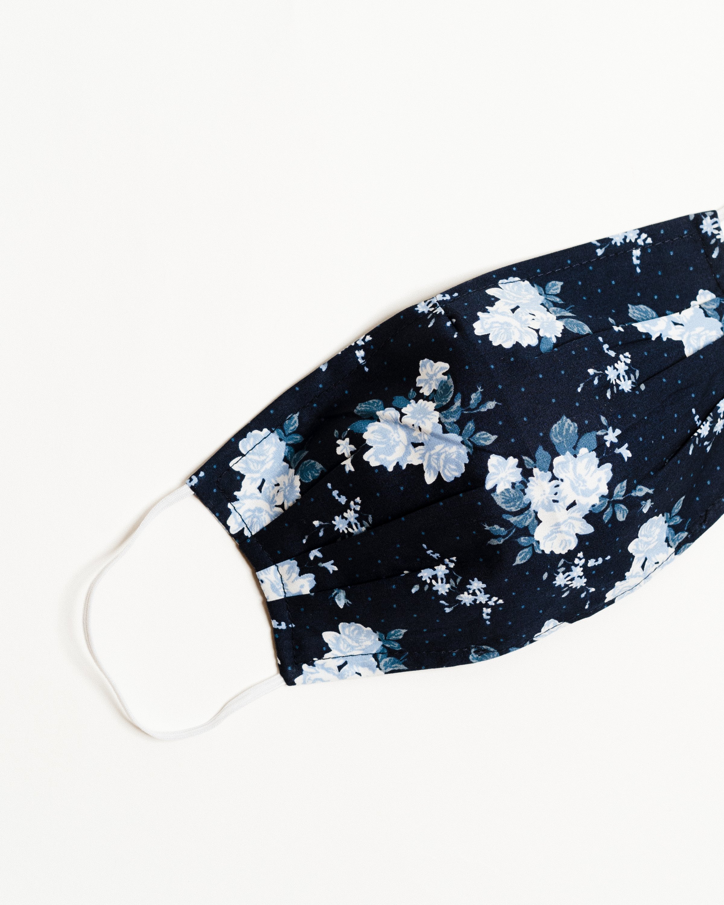 Bouquet Navy Face Mask made of breathable cotton with pleats for comfort and a filter pocket.