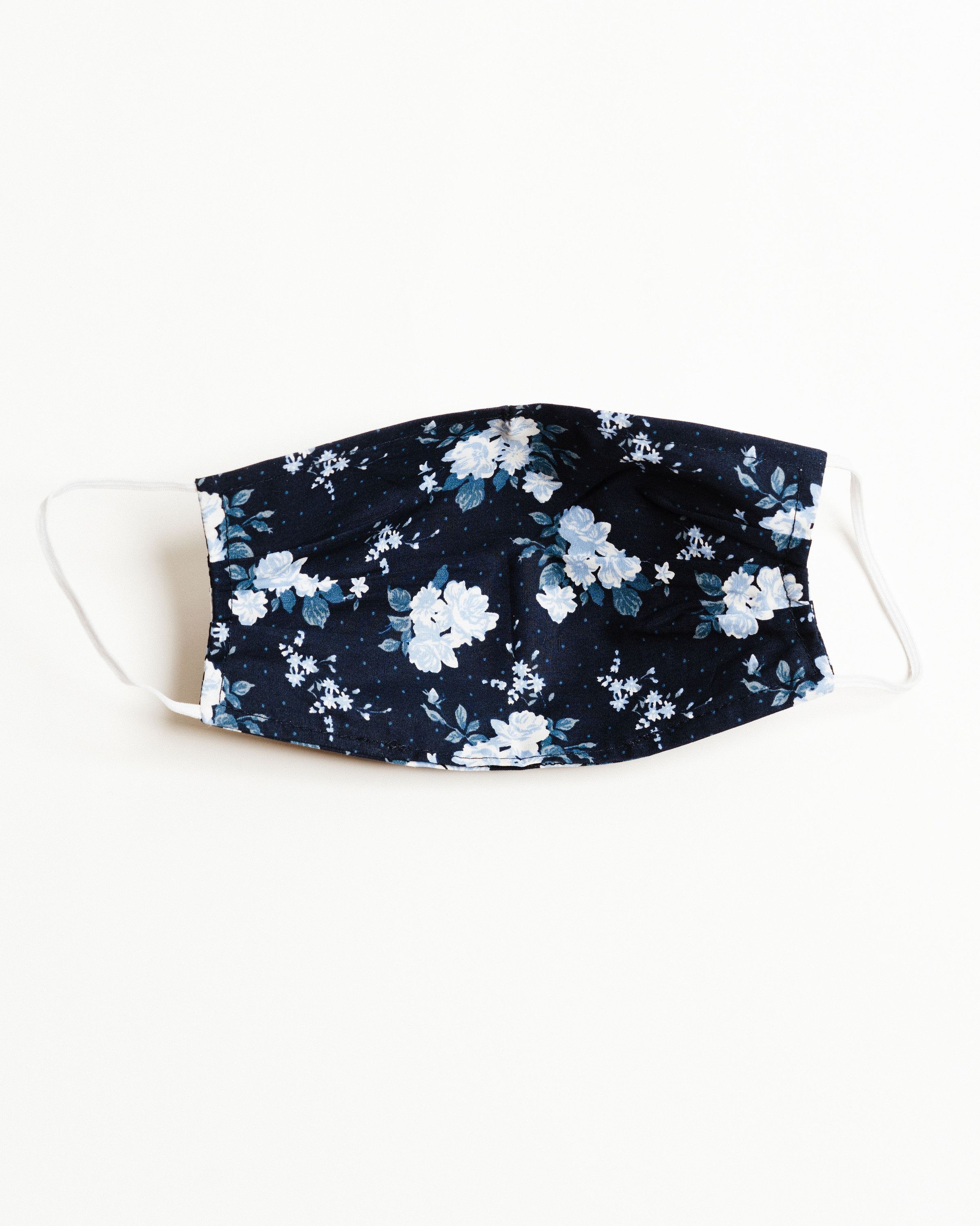 Bouquet Navy Face Mask made of breathable cotton with pleats for comfort and a filter pocket.