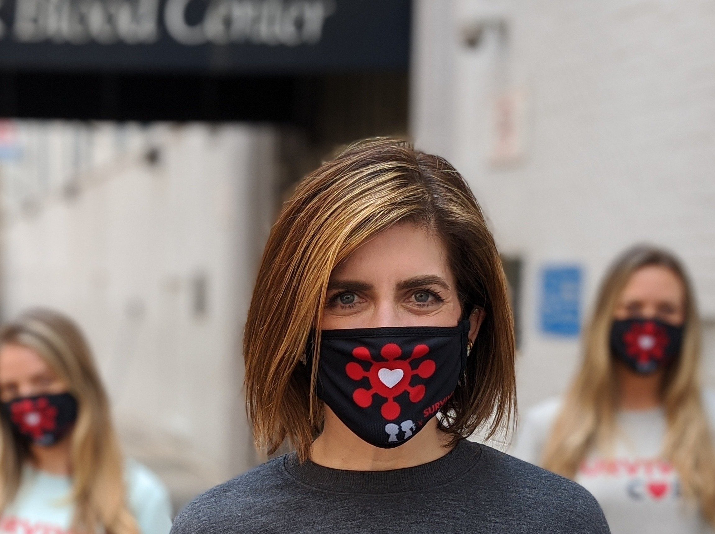 BOY MEETS GIRL® x SURVIVOR CORPS Community Mask featuring a double-layer design and adjustable elastic for comfort.