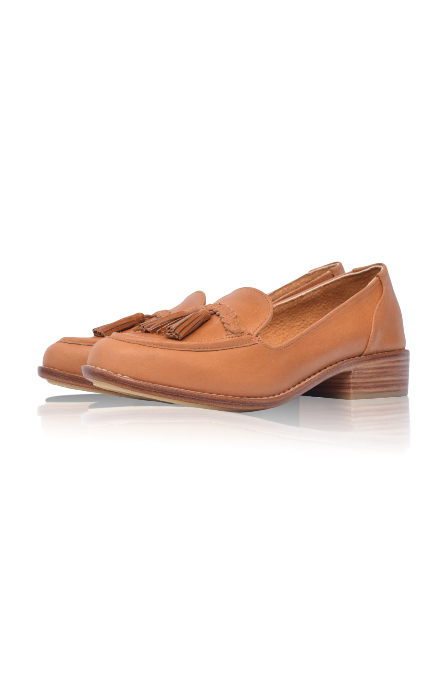 A pair of stylish Brooklyn leather loafers featuring braid and tassel details, made from 100% genuine leather.