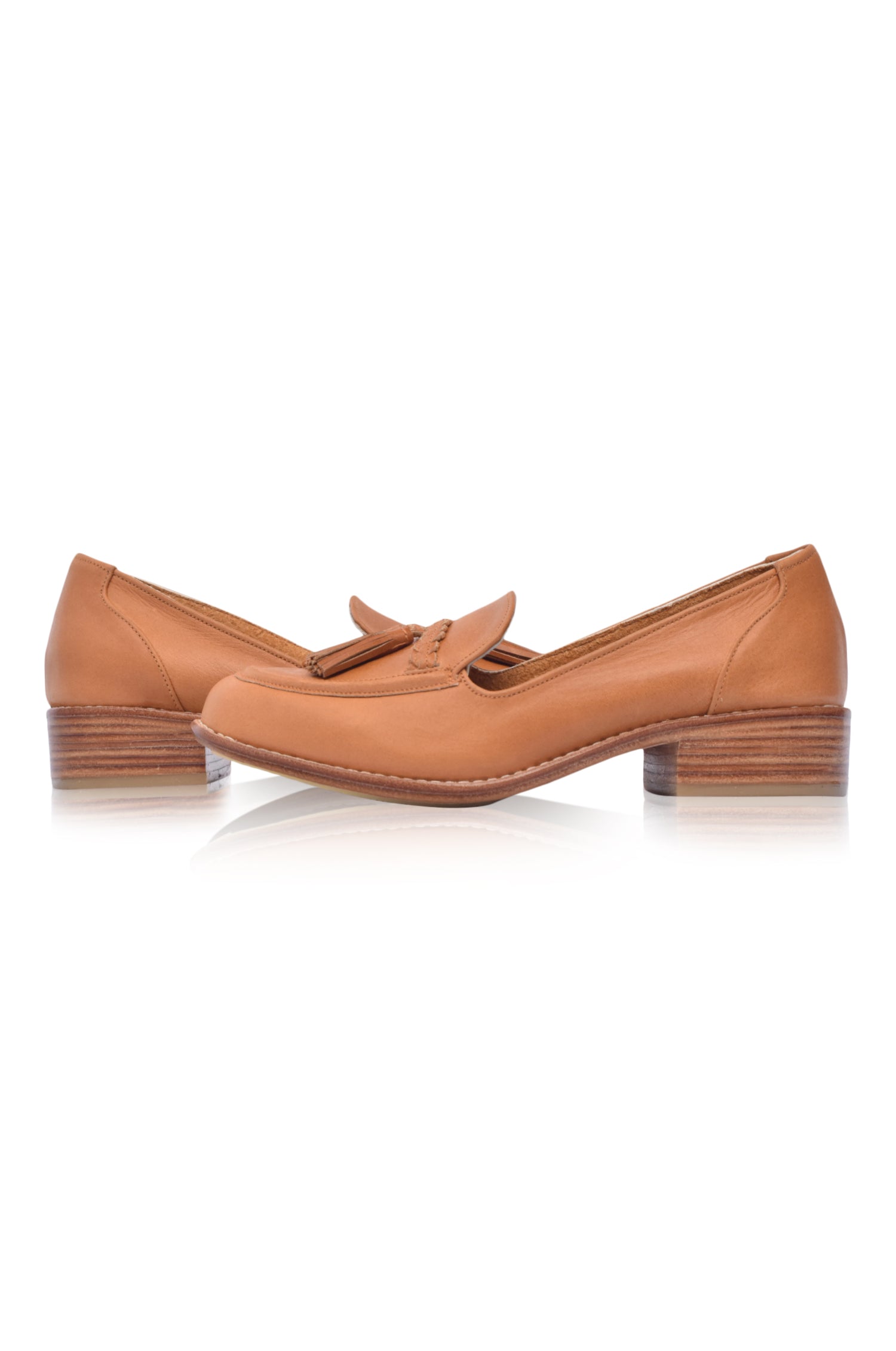 A pair of stylish Brooklyn leather loafers featuring braid and tassel details, made from 100% genuine leather.