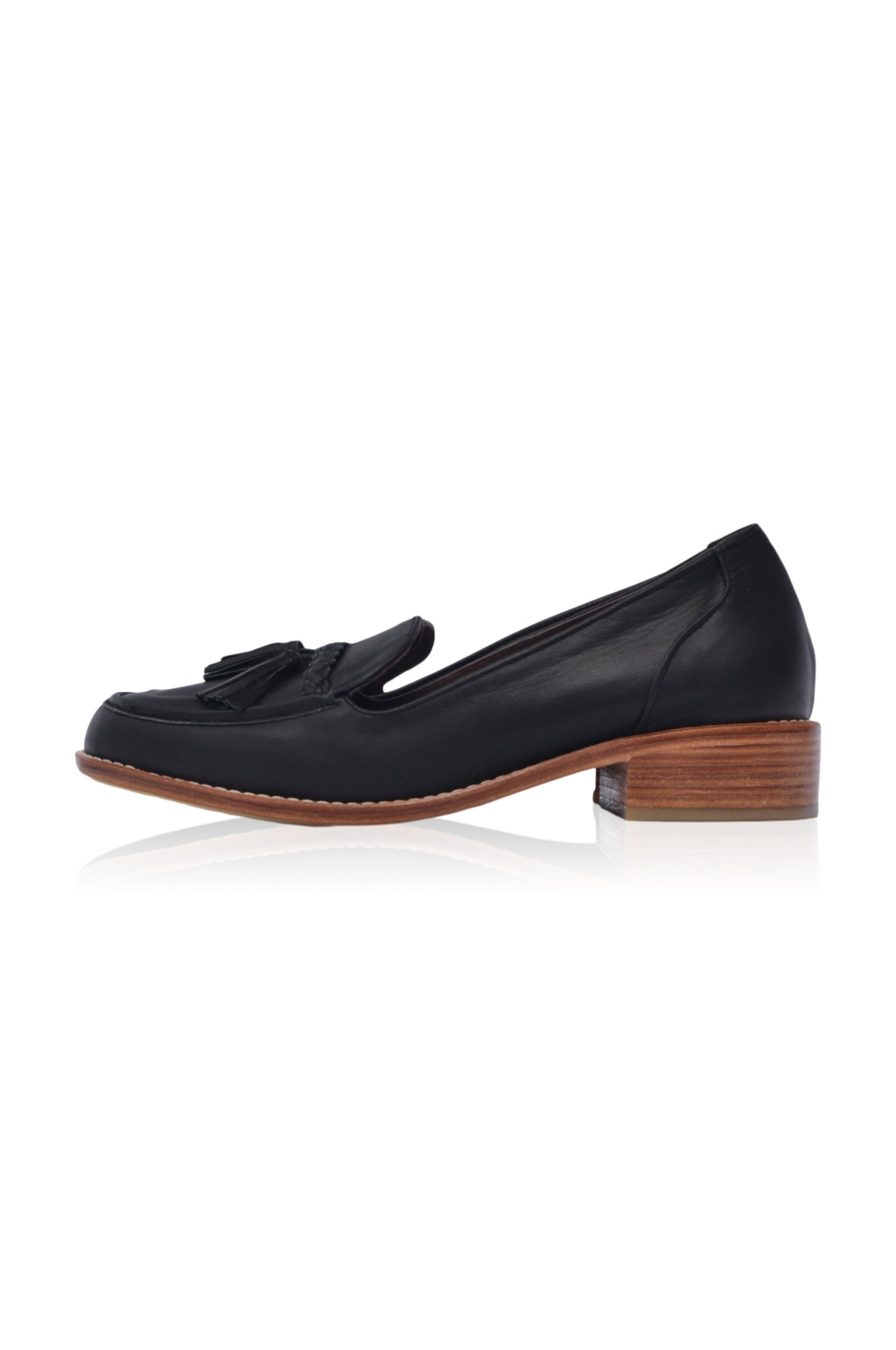 A pair of stylish Brooklyn leather loafers featuring braid and tassel details, made from 100% genuine leather.