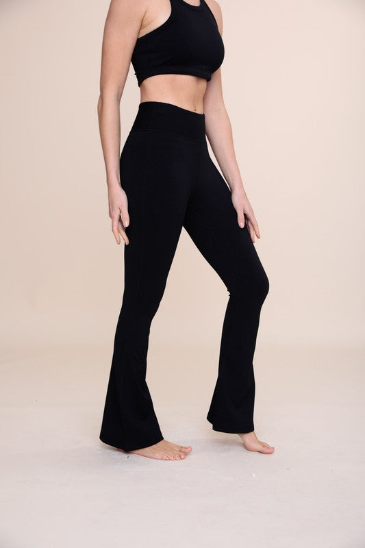 BRONZE Ribbed Flare High-Waist Leggings showcasing a stylish ribbed texture and flattering high-waist design.