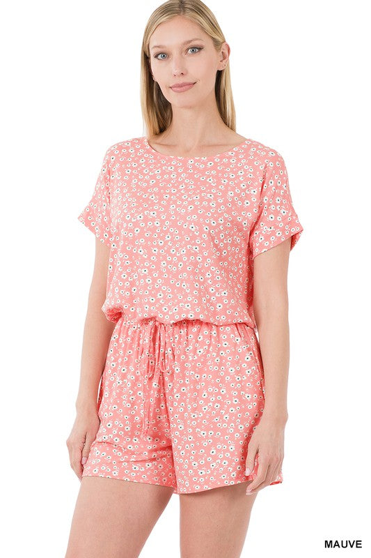 Brushed Dty Floral Romper featuring a floral print, elastic waist, and pockets, perfect for summer wear.