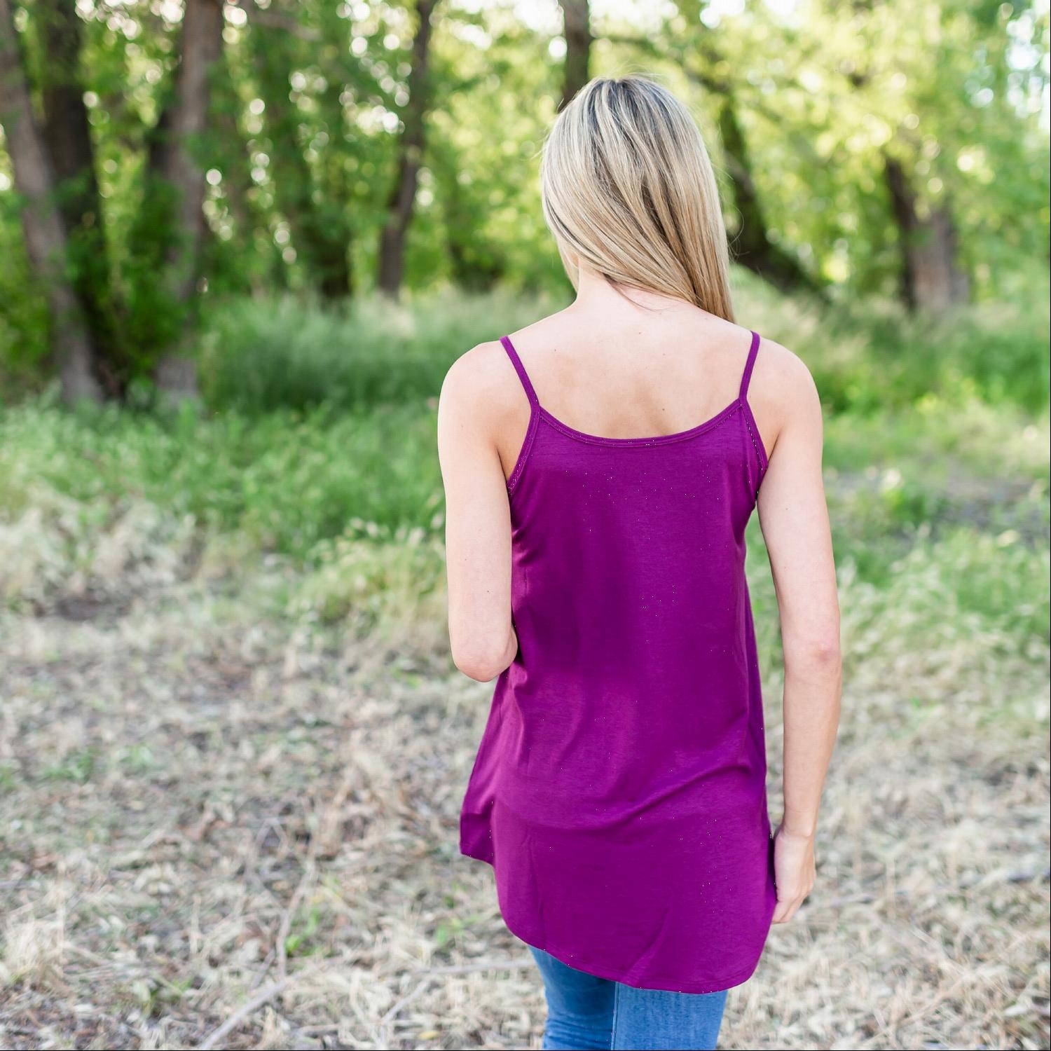 A stylish Bubble Crepe Camisole Top featuring spaghetti straps and a tunic length, perfect for summer outfits.