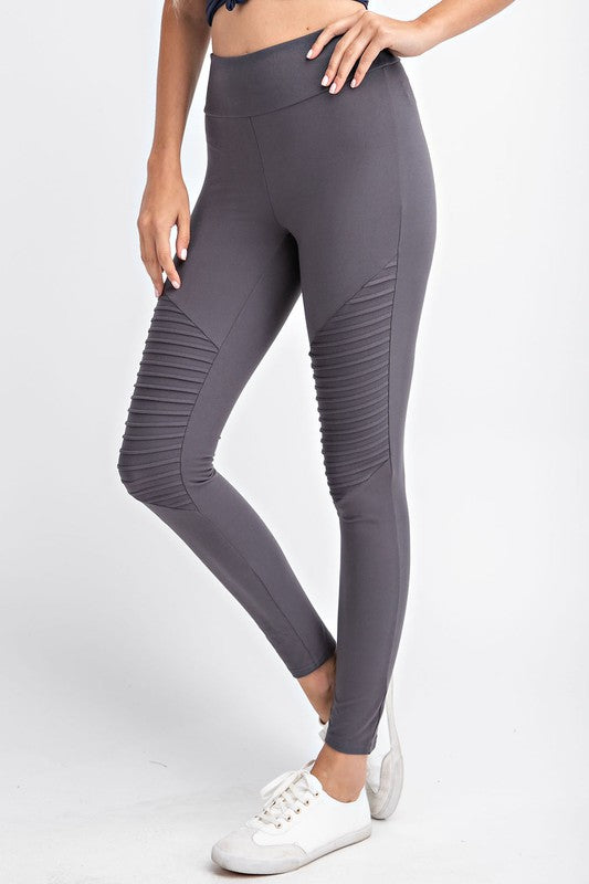 A pair of Butter Soft Moto Leggings featuring stylish moto detailing, high waist, and a key pocket, displayed on a mannequin.