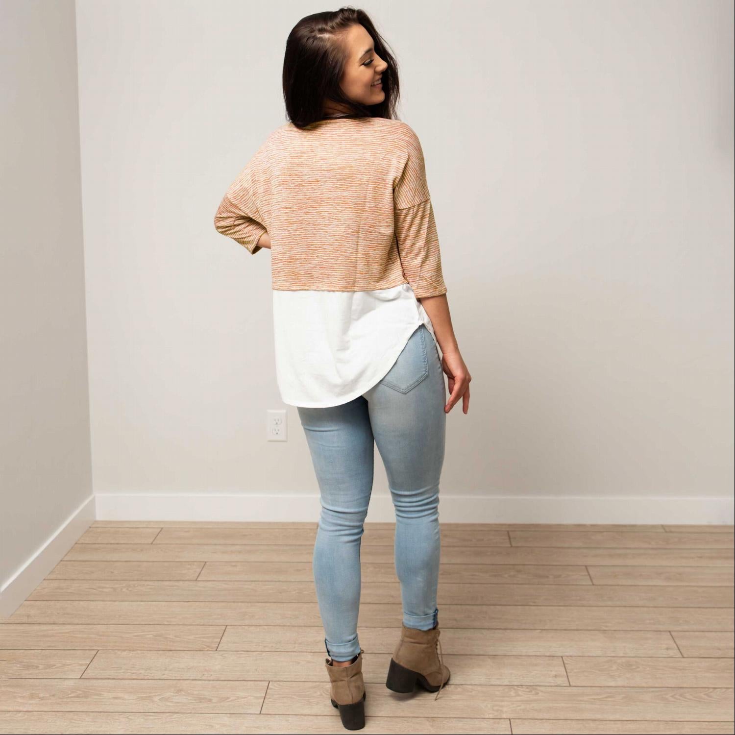 Button Down 3/4 Sleeve Knit Top featuring faux layered design, buttons, and rounded hemline in soft fabric.