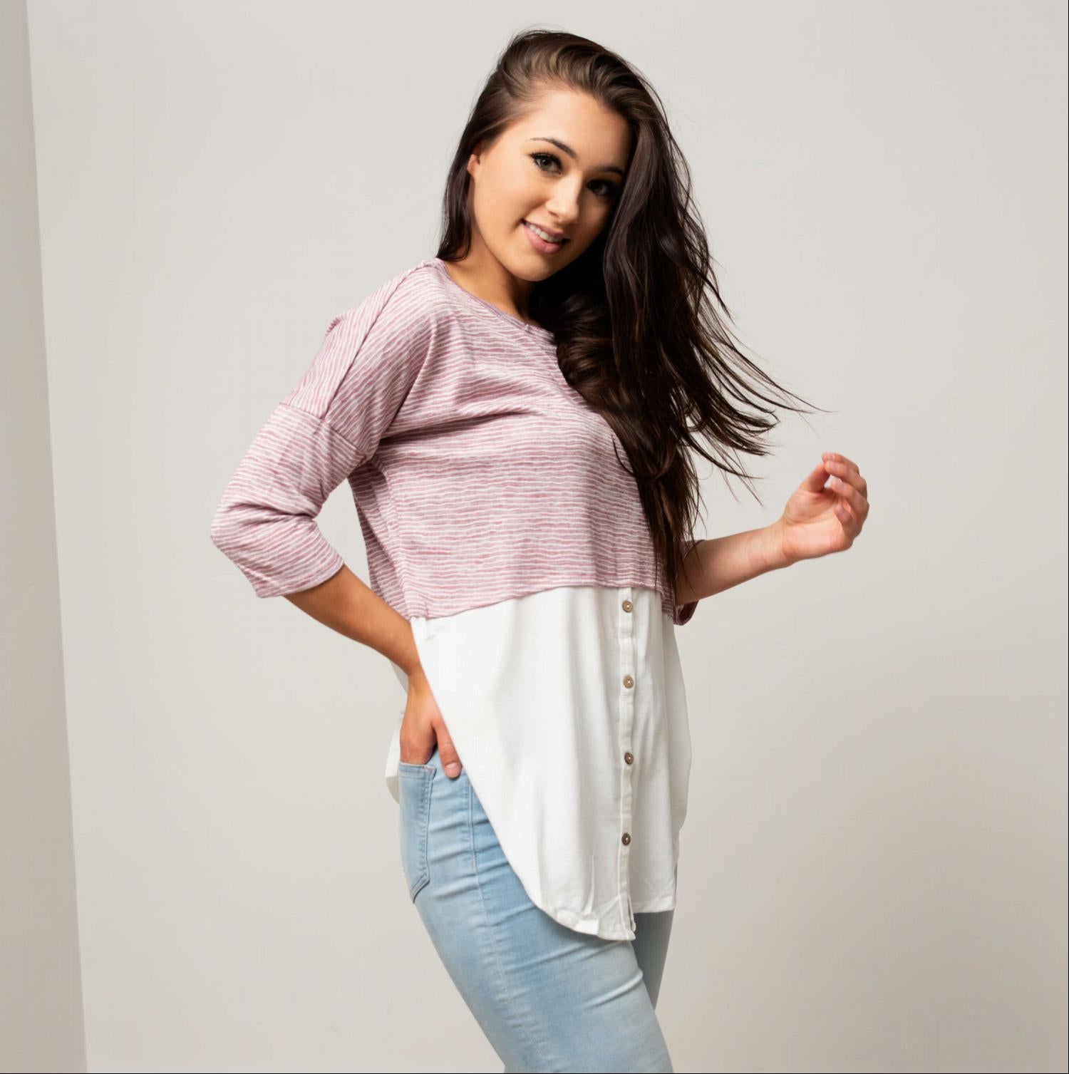 Button Down 3/4 Sleeve Knit Top featuring faux layered design, buttons, and rounded hemline in soft fabric.