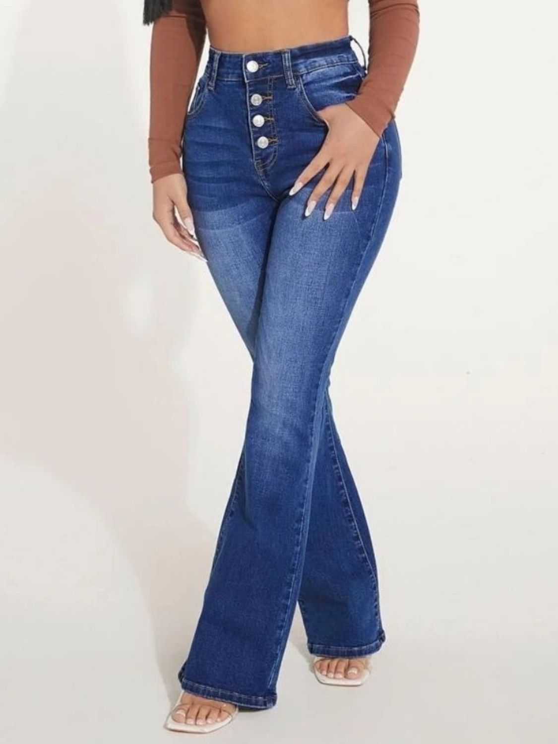 A pair of stylish button fly bootcut jeans with pockets, showcasing a moderate stretch fabric and a classic design suitable for various occasions.