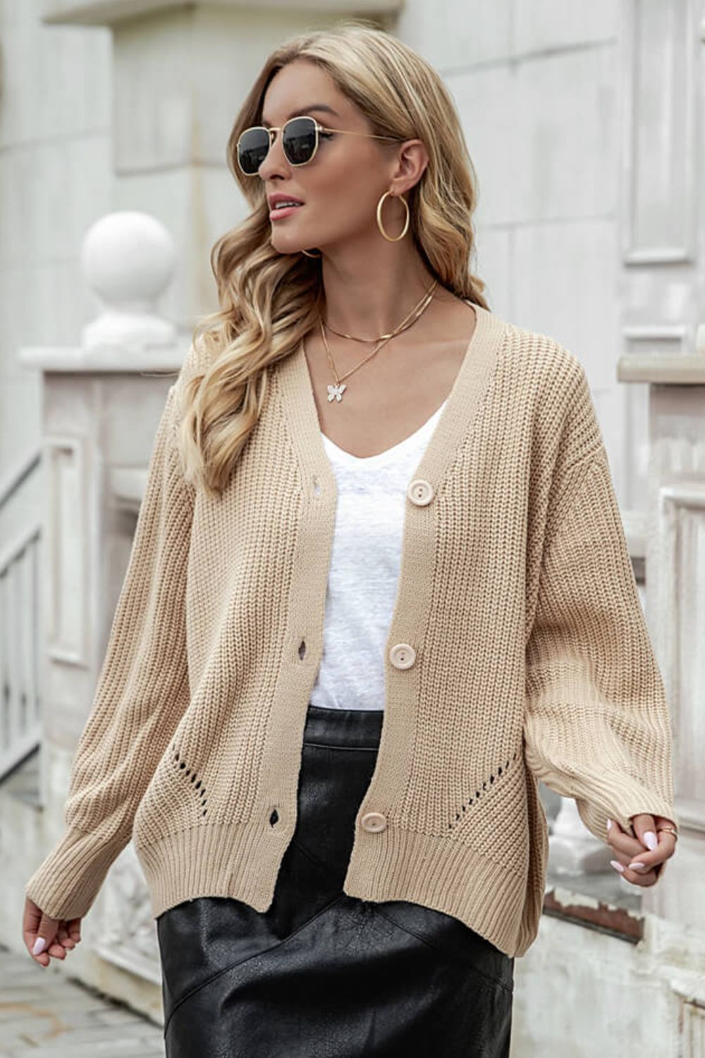 A stylish Button Front Dropped Shoulder Cardigan in solid color, featuring long lantern sleeves and a V-neckline, perfect for casual wear.