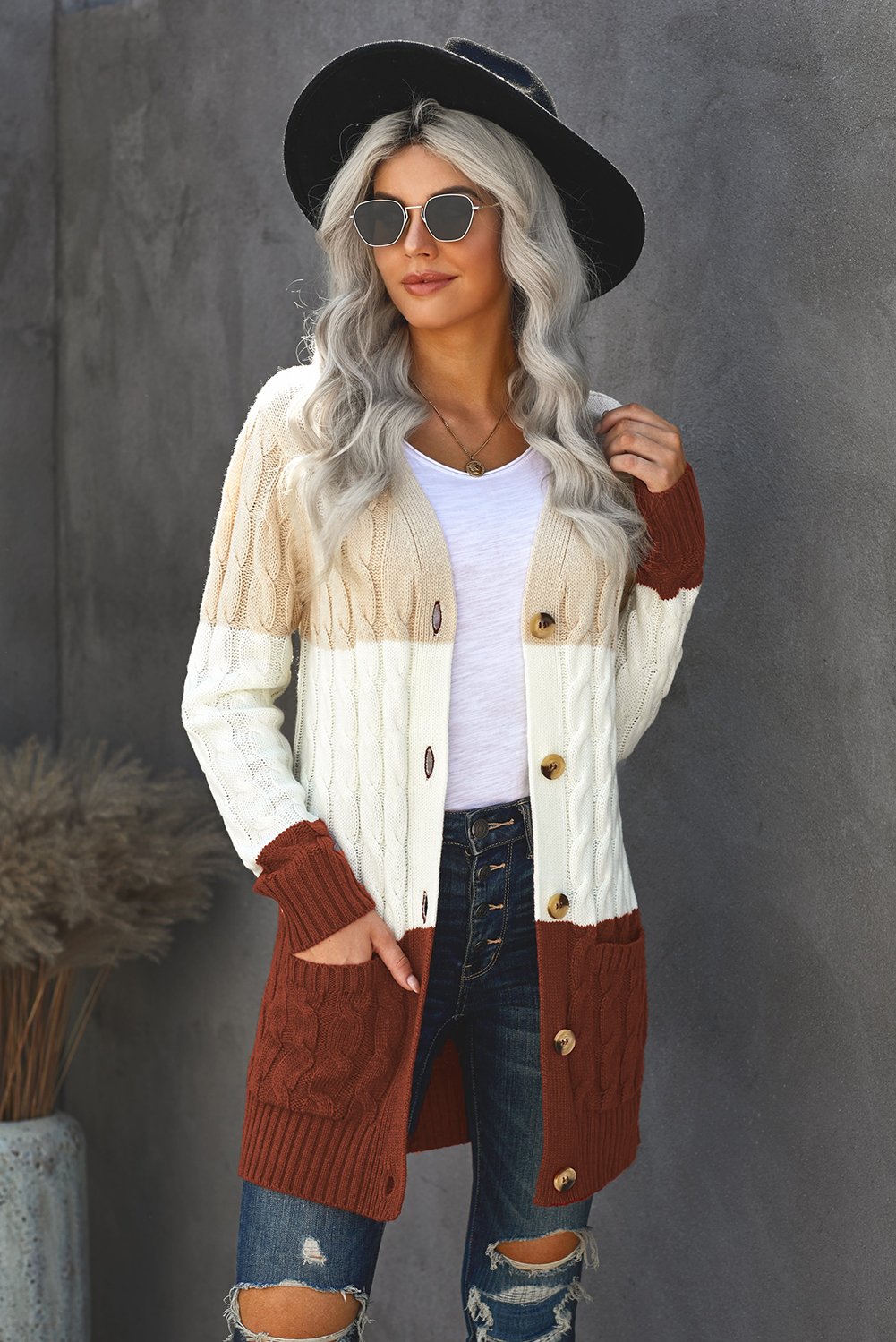 A cozy Button Pocket Knit Cardigan featuring a chunky button-up design, long sleeves, ribbed hem, and a front pocket, perfect for chilly days.